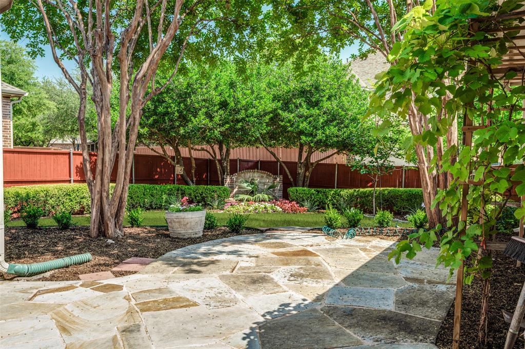 1212 Rio Grande Court Allen, TX 75013 - Photo 32 of 34 a front view of a house with garden