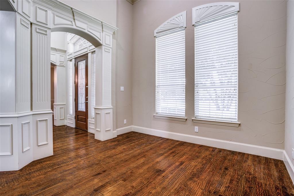 1212 Rio Grande Court Allen, TX 75013 - Photo 6 of 34 an empty room with wooden floor and windows