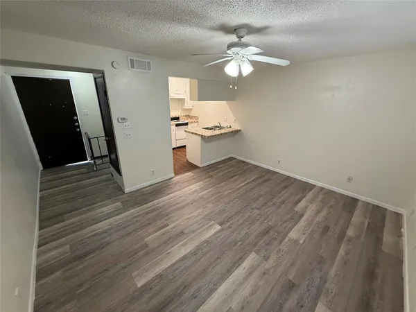 wooden floor in an empty room with a mirror