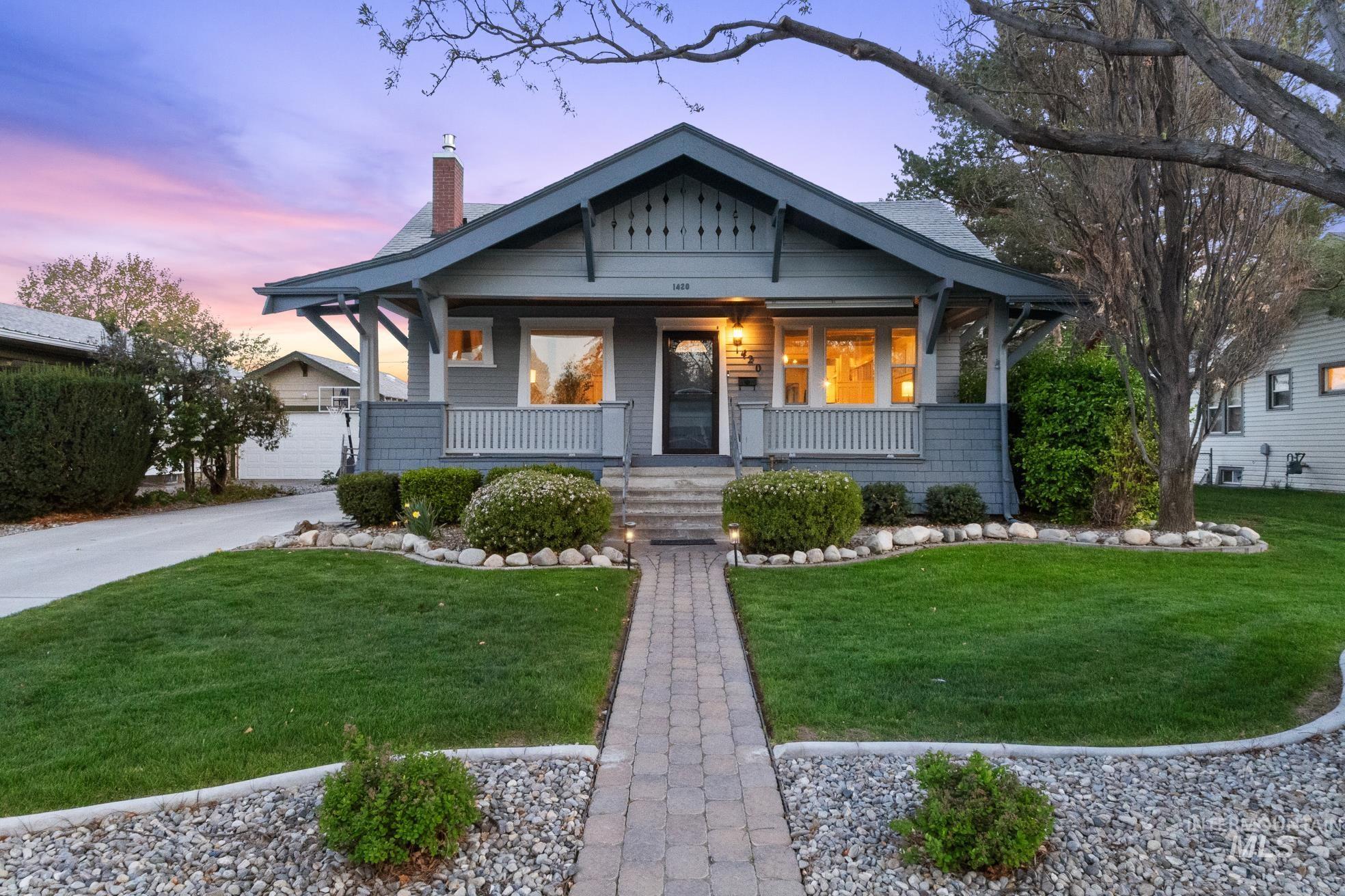 1420 Maple Avenue Twin Falls, ID 83301 - Photo 1 of 1 Bungalow-style home with a porch, a chimney, and a yard