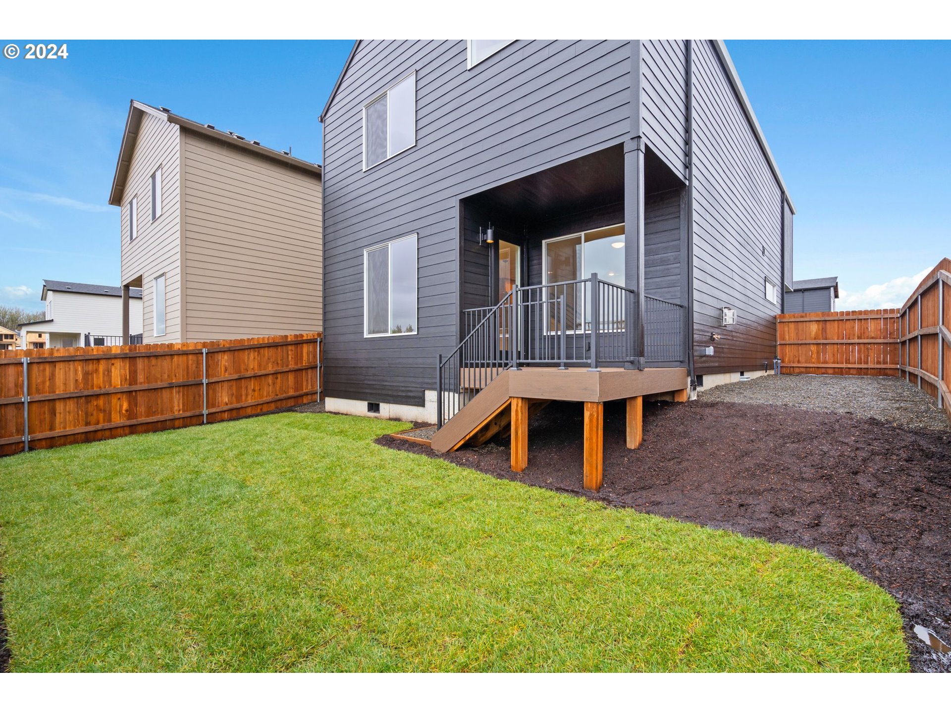 910 Northwest 175th Way Ridgefield, WA 98642 - Photo 14 of 16 a view of a house with a yard