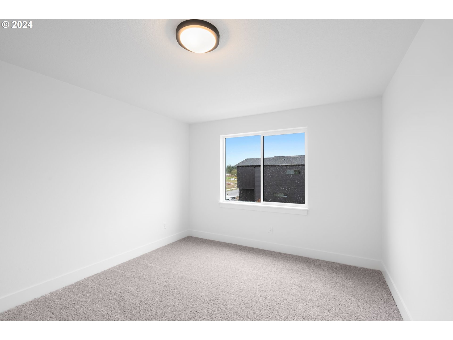 910 Northwest 175th Way Ridgefield, WA 98642 - Photo 7 of 16 a view of an empty room with a window