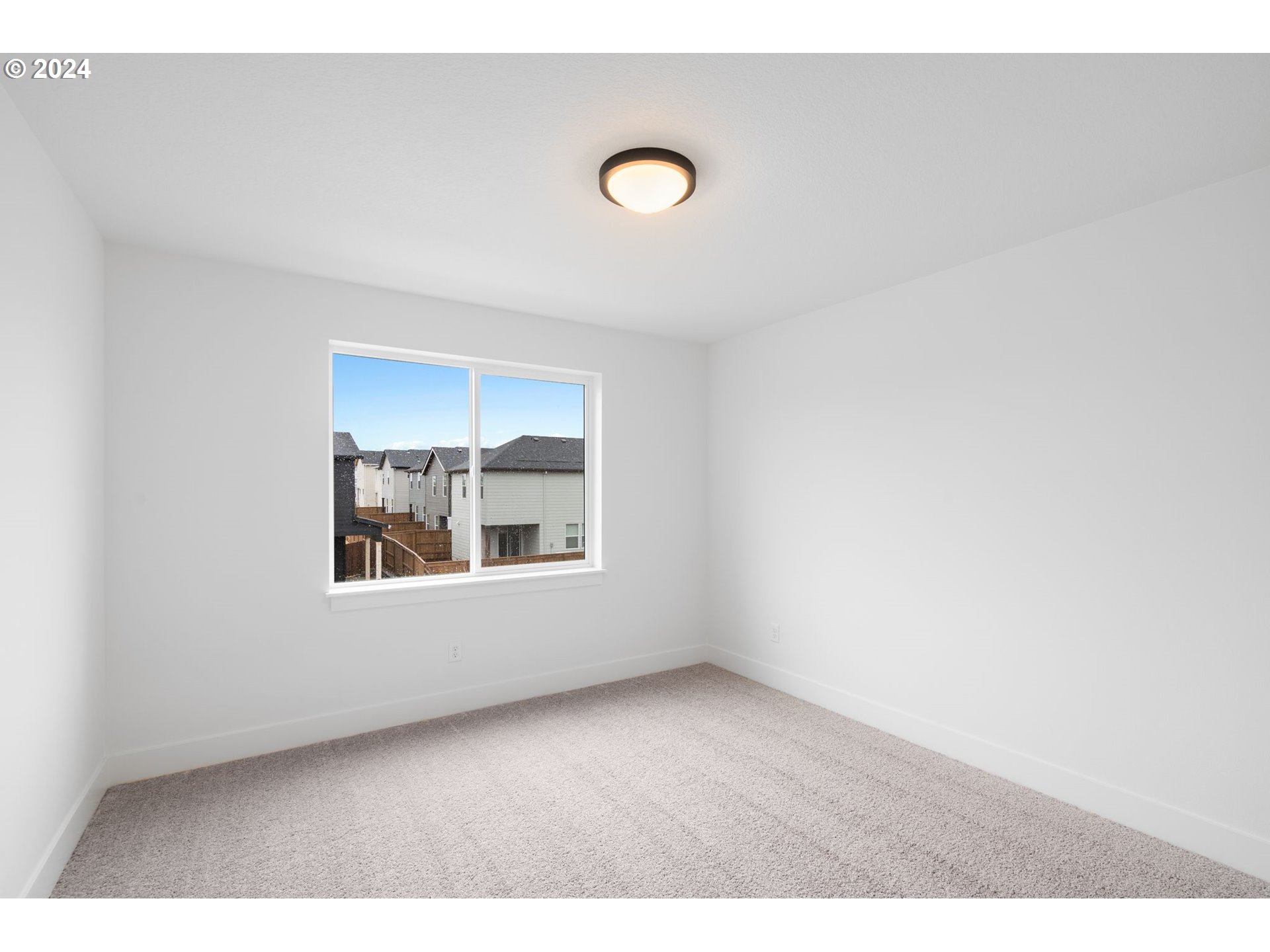 910 Northwest 175th Way Ridgefield, WA 98642 - Photo 8 of 16 a view of an empty room with a window