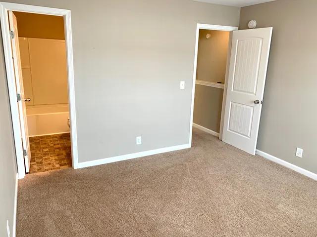 a bathroom with a toilet a sink and bathtub