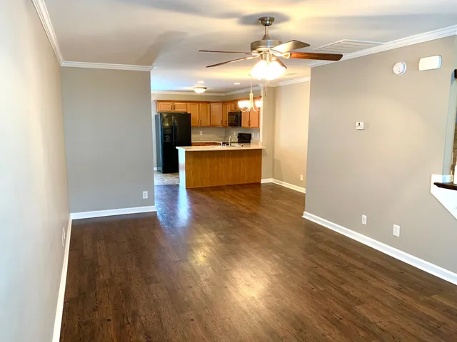 a view of a kitchen with wooden floor