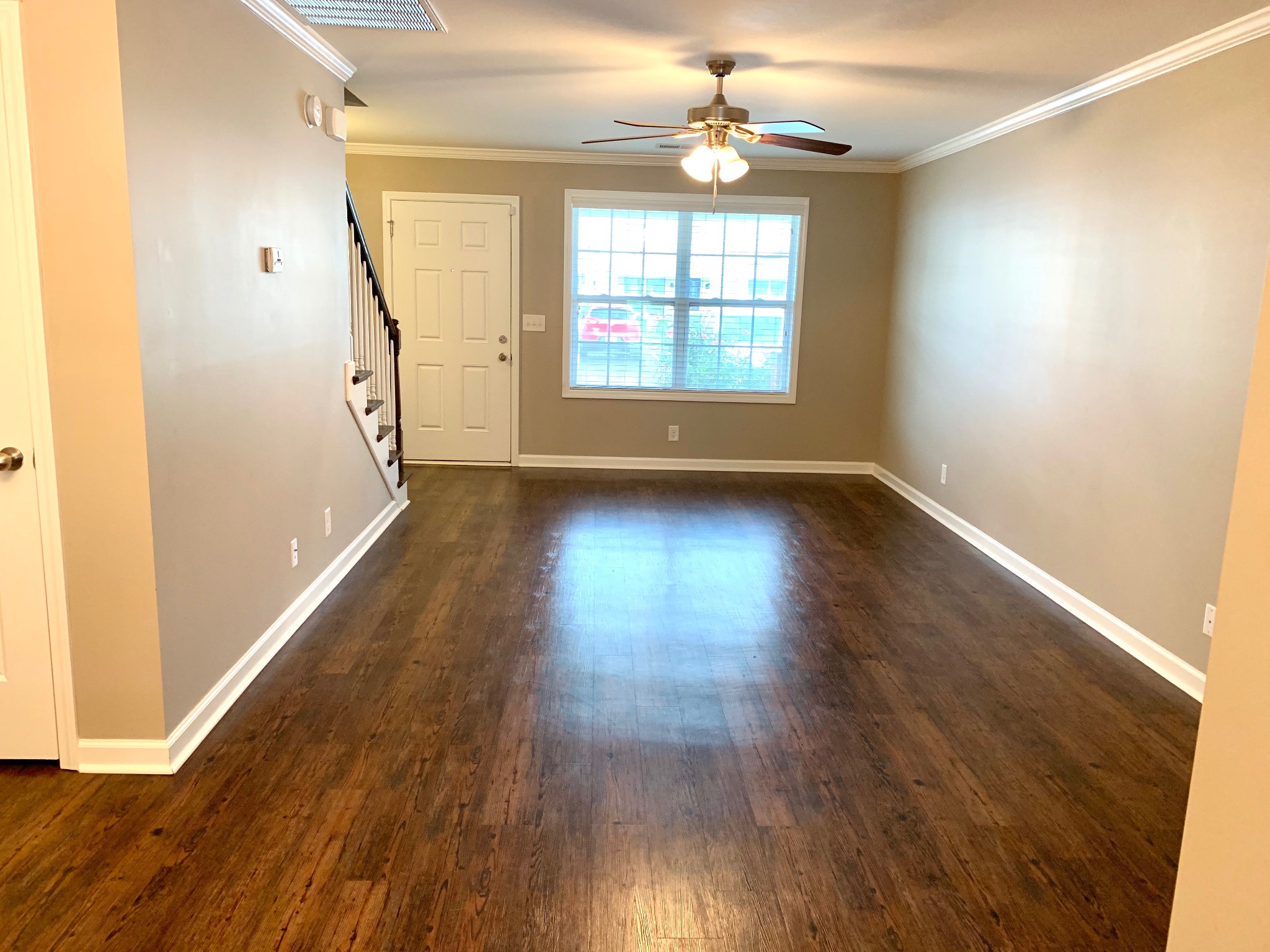 318 Sam Houston Circle Clarksville, TN 37040 - Photo 4 of 20 a view of an empty room with wooden floor and a window