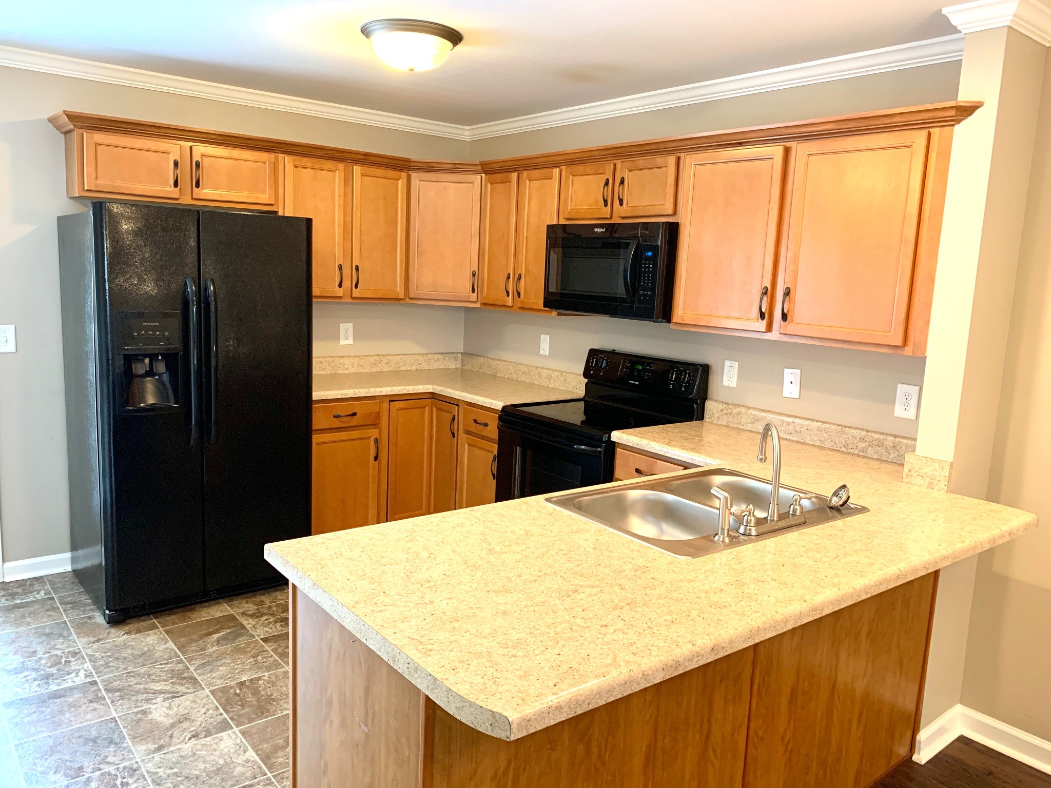 318 Sam Houston Circle Clarksville, TN 37040 - Photo 7 of 20 a kitchen with stainless steel appliances a microwave a sink and cabinets