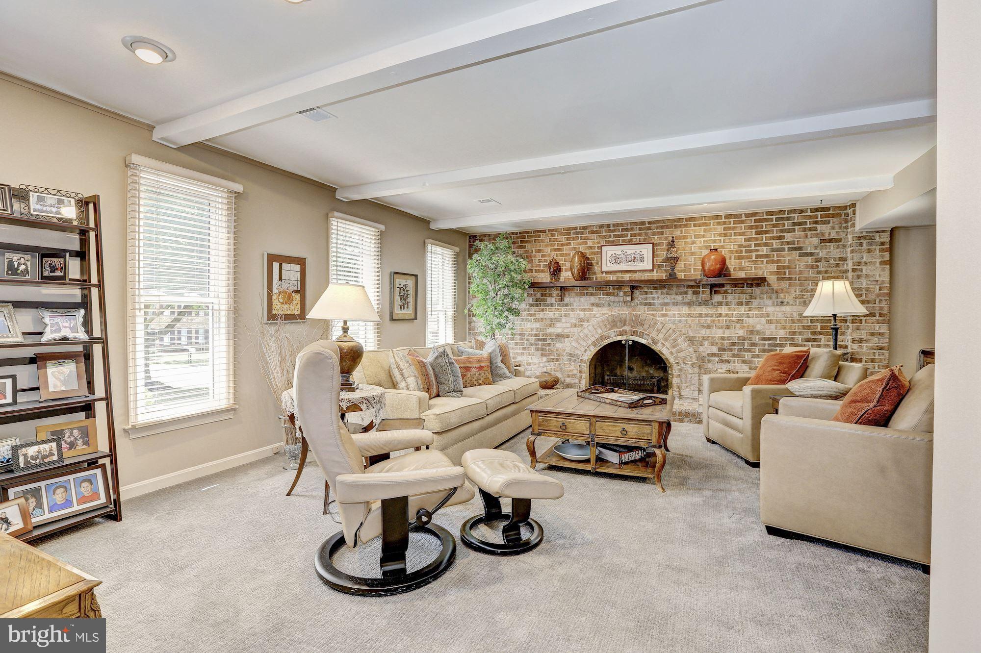 15128 Middlegate Road Silver Spring, MD 20905 - Photo 6 of 17 Family room with wood burning FP, brick hearth