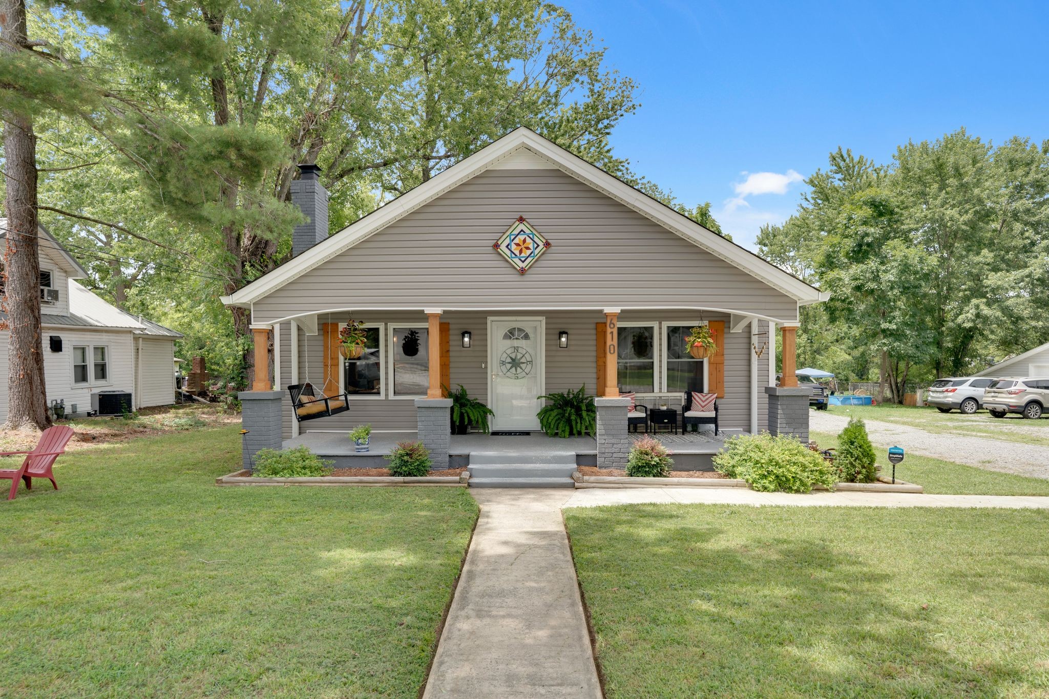 a front view of house with yard and green space
