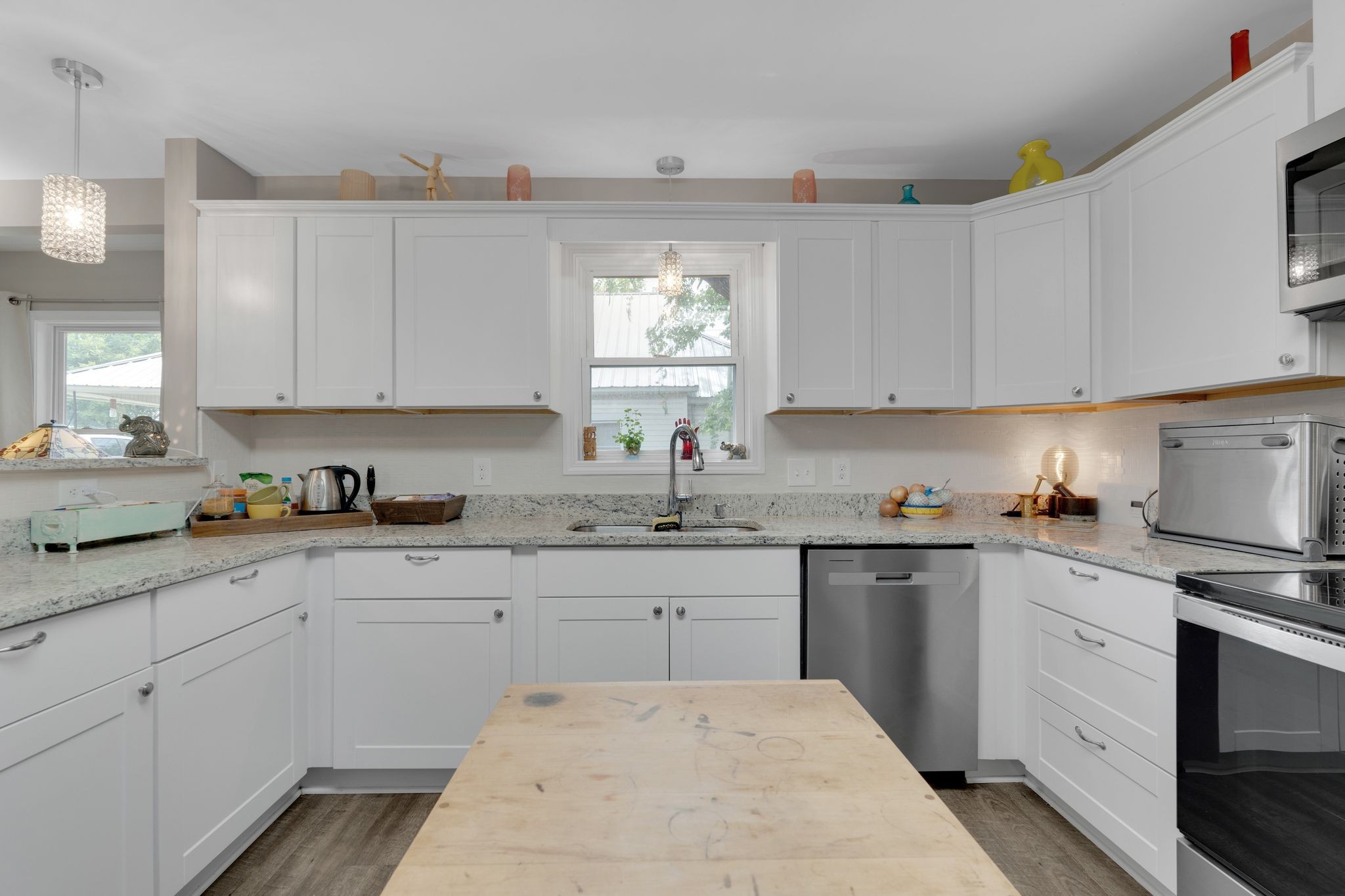 610 Polk Street Manchester, TN 37355 - Photo 14 of 30 a kitchen with cabinets appliances a sink and a window