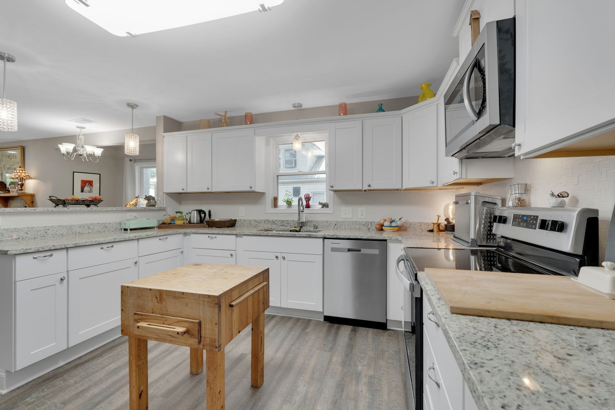 610 Polk Street Manchester, TN 37355 - Photo 15 of 30 a kitchen with stainless steel appliances granite countertop a stove a sink dishwasher and a refrigerator