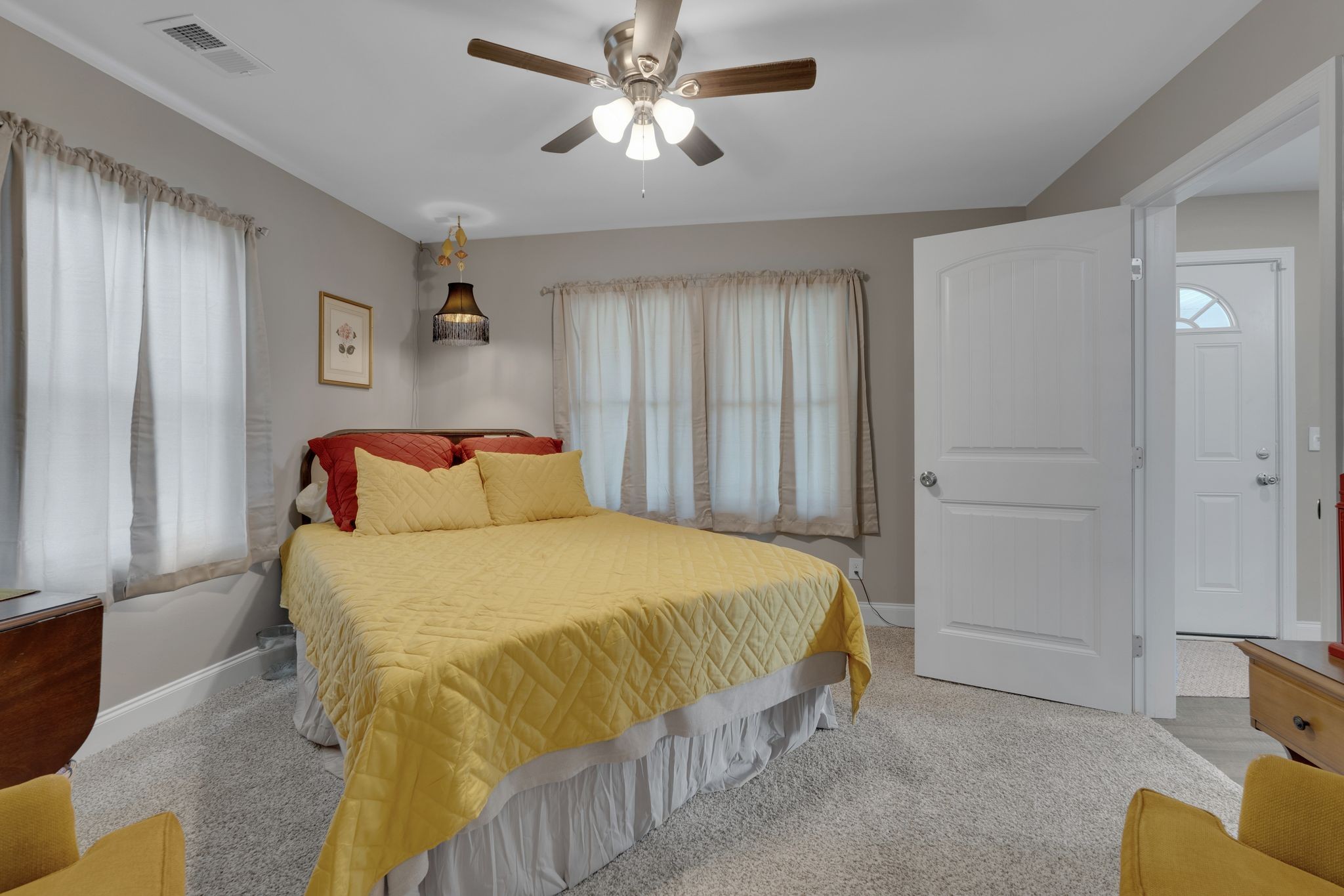 610 Polk Street Manchester, TN 37355 - Photo 19 of 30 a bedroom with a bed and a chandelier