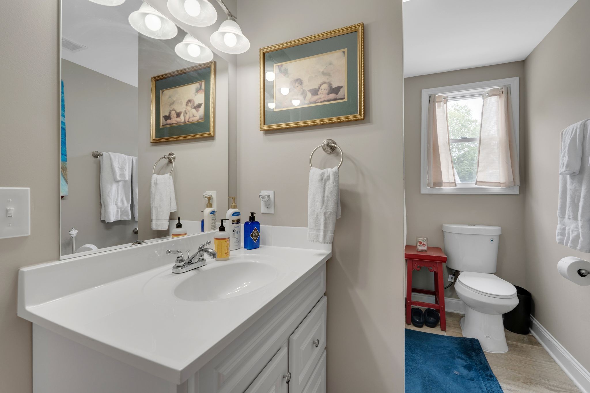 610 Polk Street Manchester, TN 37355 - Photo 20 of 30 a bathroom with a sink mirror vanity and toilet