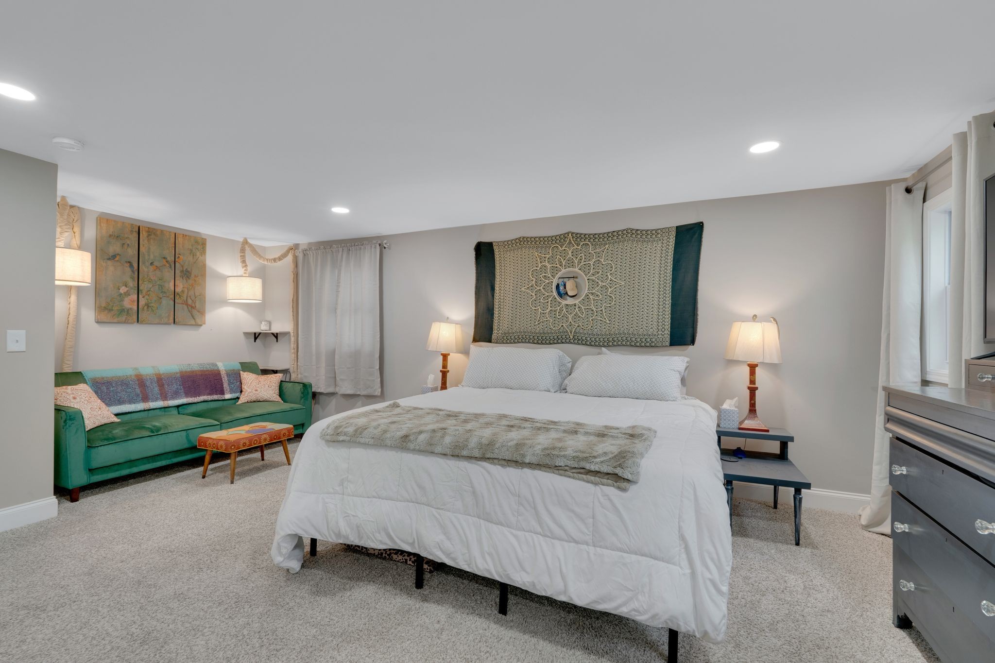 610 Polk Street Manchester, TN 37355 - Photo 24 of 30 a spacious bedroom with a bed and a chandelier