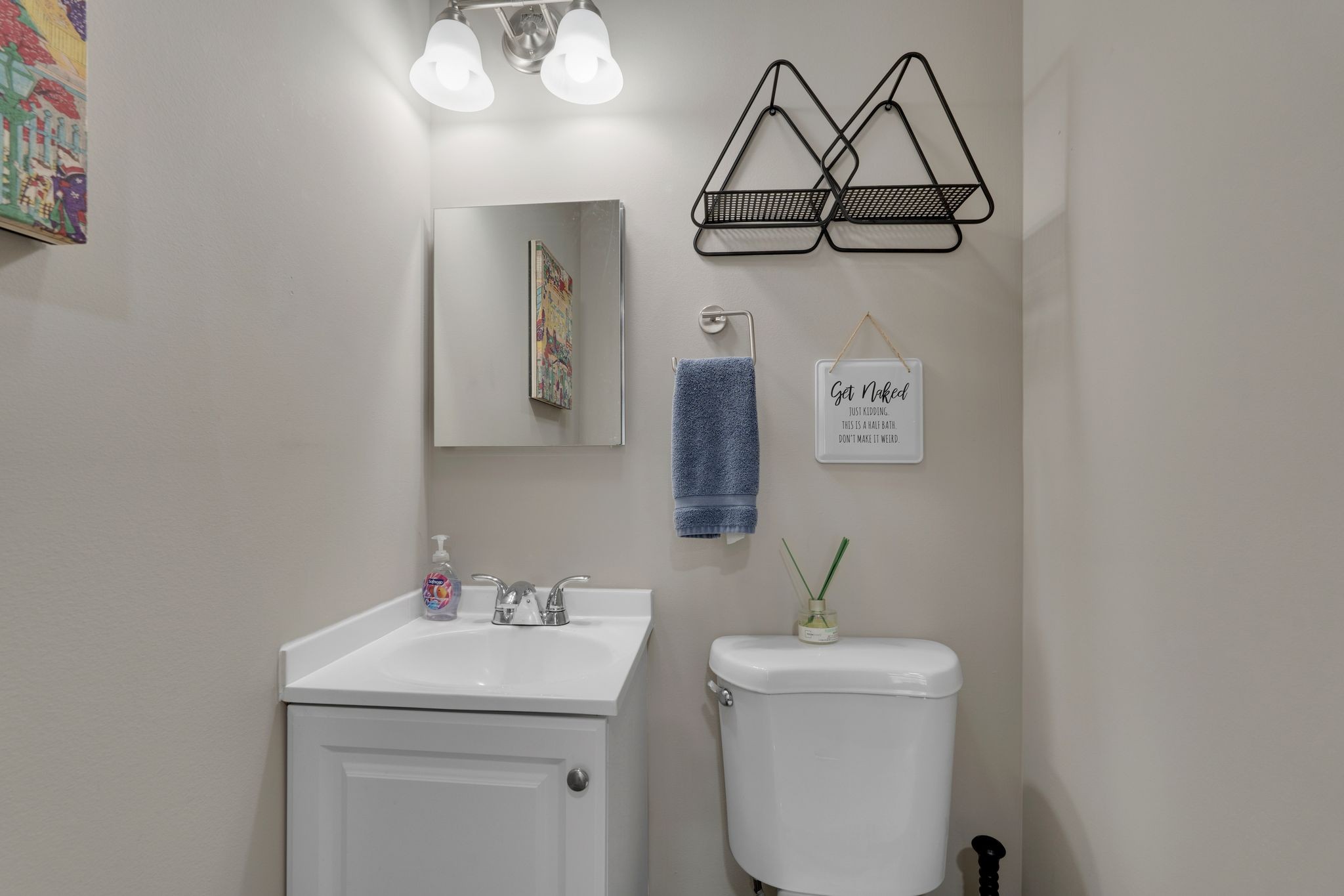 610 Polk Street Manchester, TN 37355 - Photo 28 of 30 a bathroom with a sink a light fixture and a toilet