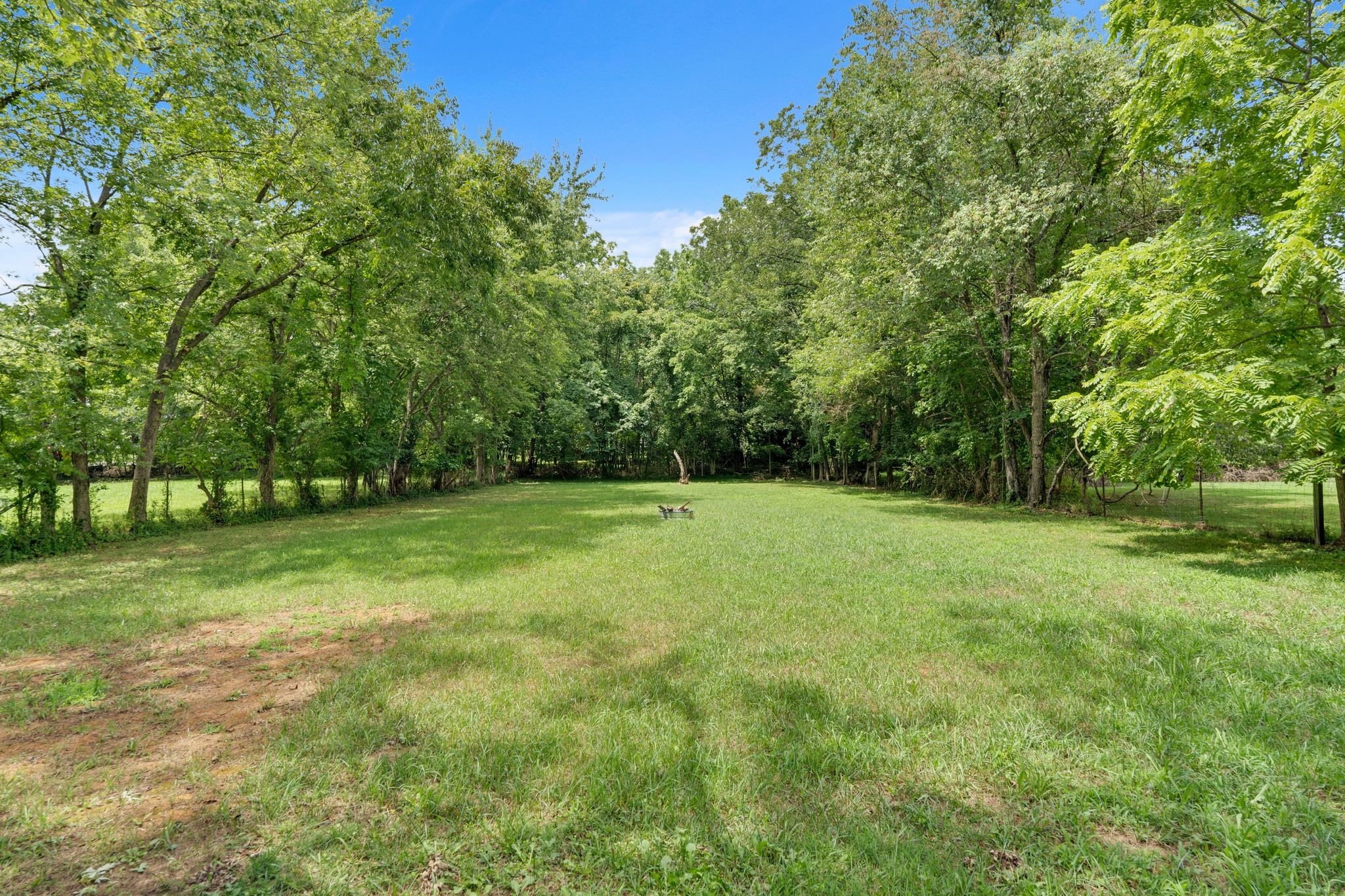 610 Polk Street Manchester, TN 37355 - Photo 30 of 30 a view of a field with trees in the background