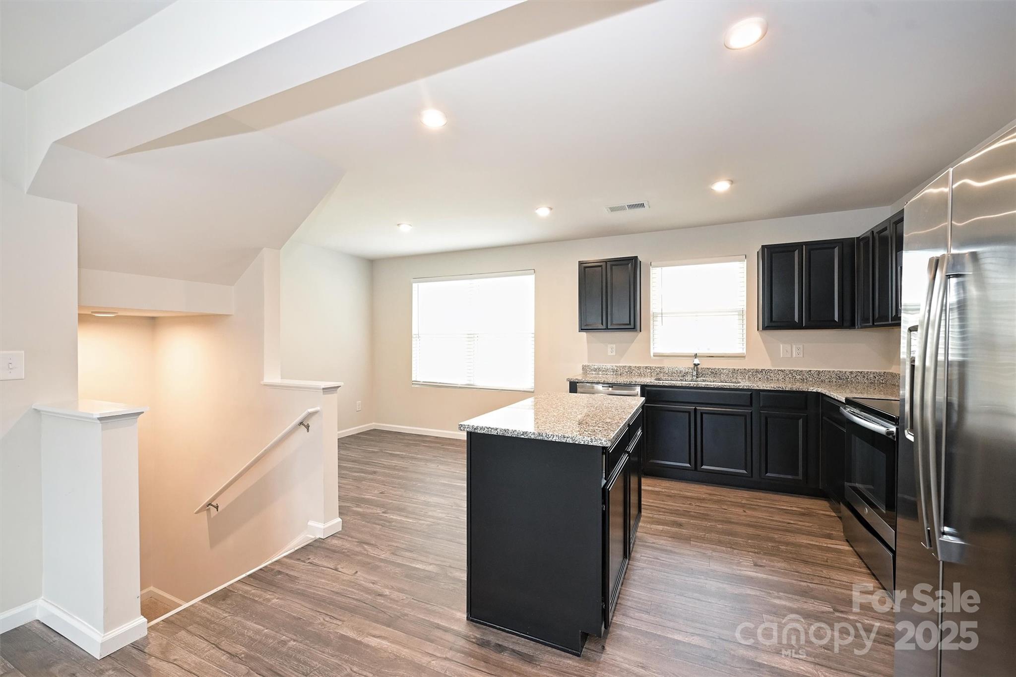 825 Renee Avenue Fort Mill, SC 29715 - Photo 11 of 30 a kitchen with granite countertop a sink and refrigerator