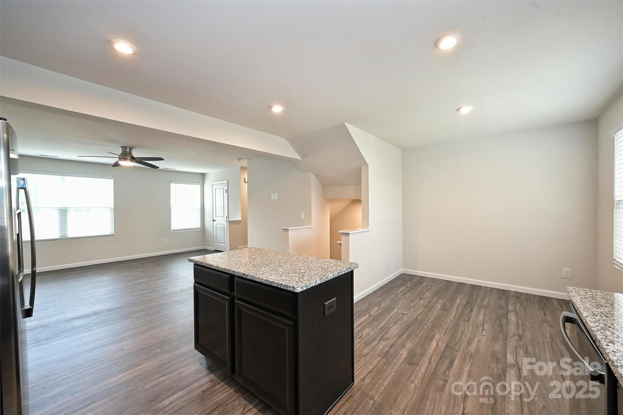 825 Renee Avenue Fort Mill, SC 29715 - Photo 12 of 30 a kitchen with a wooden floor and window