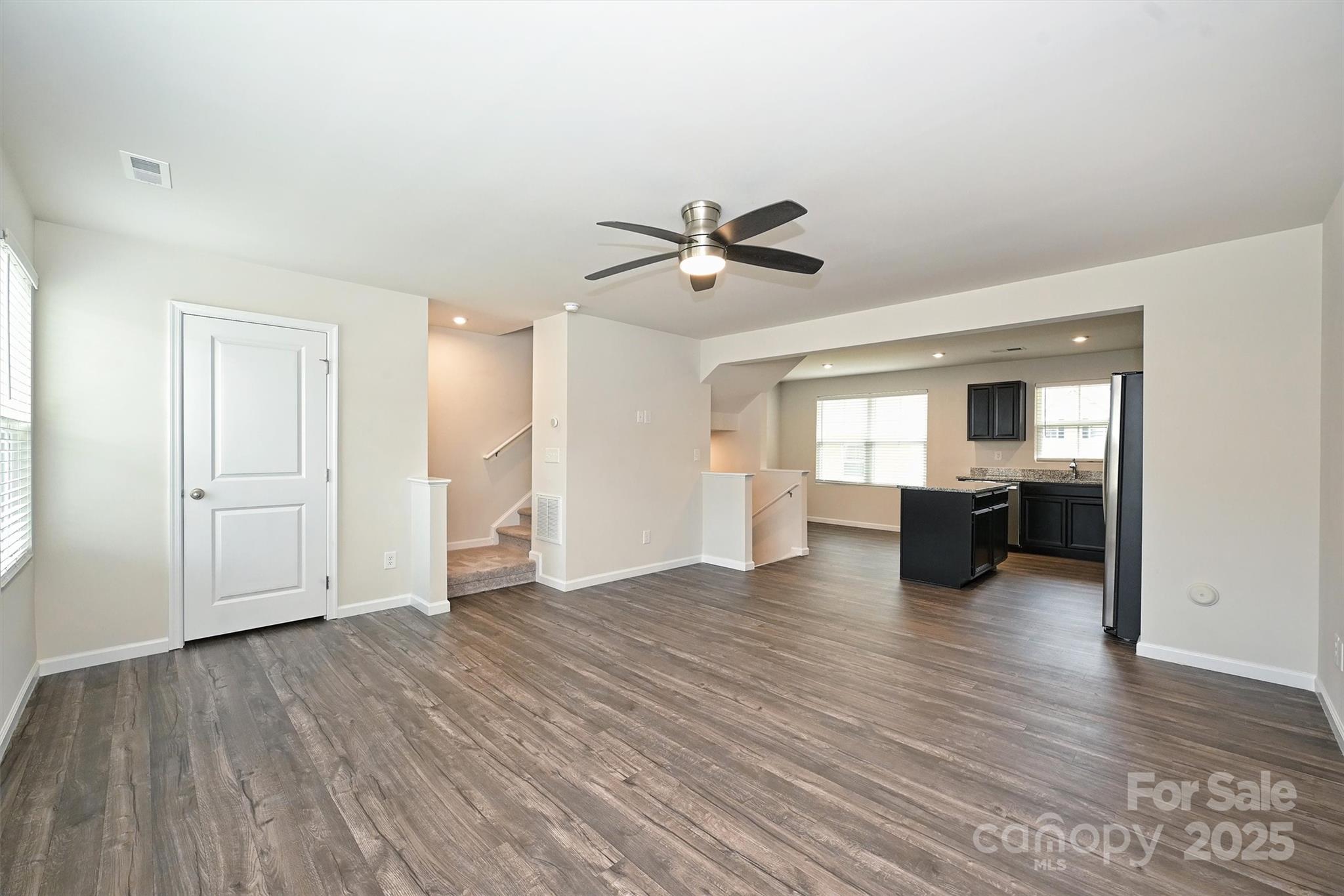 825 Renee Avenue Fort Mill, SC 29715 - Photo 17 of 30 a view of an empty room with window and wooden floor