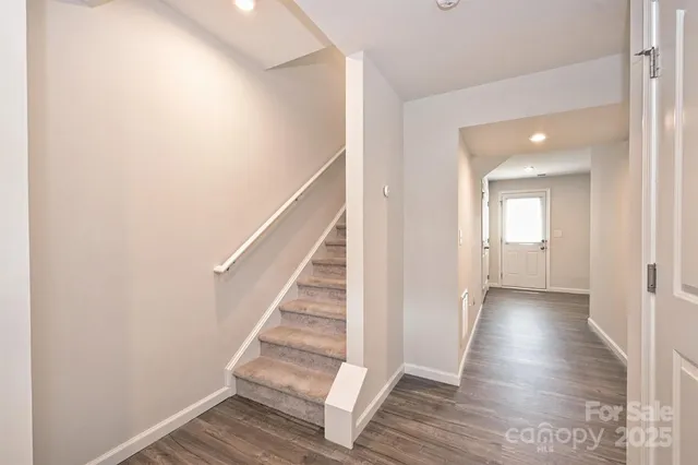 a view of entryway with wooden floor