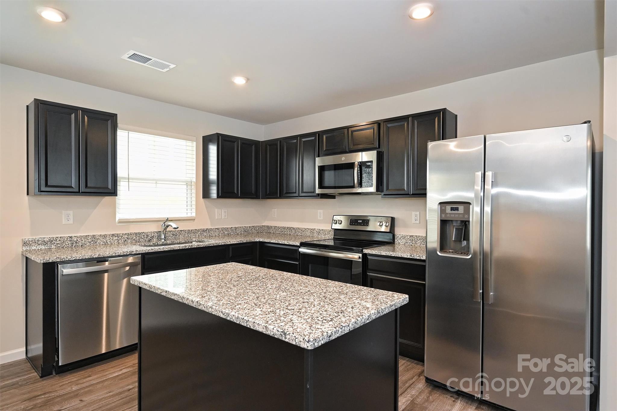 825 Renee Avenue Fort Mill, SC 29715 - Photo 10 of 30 a kitchen with a sink stove and refrigerator