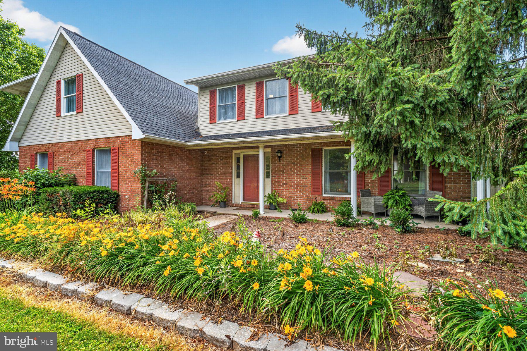 49 Rockland Road Westminster, MD 21158 - Photo 17 of 66 a front view of a house with a garden