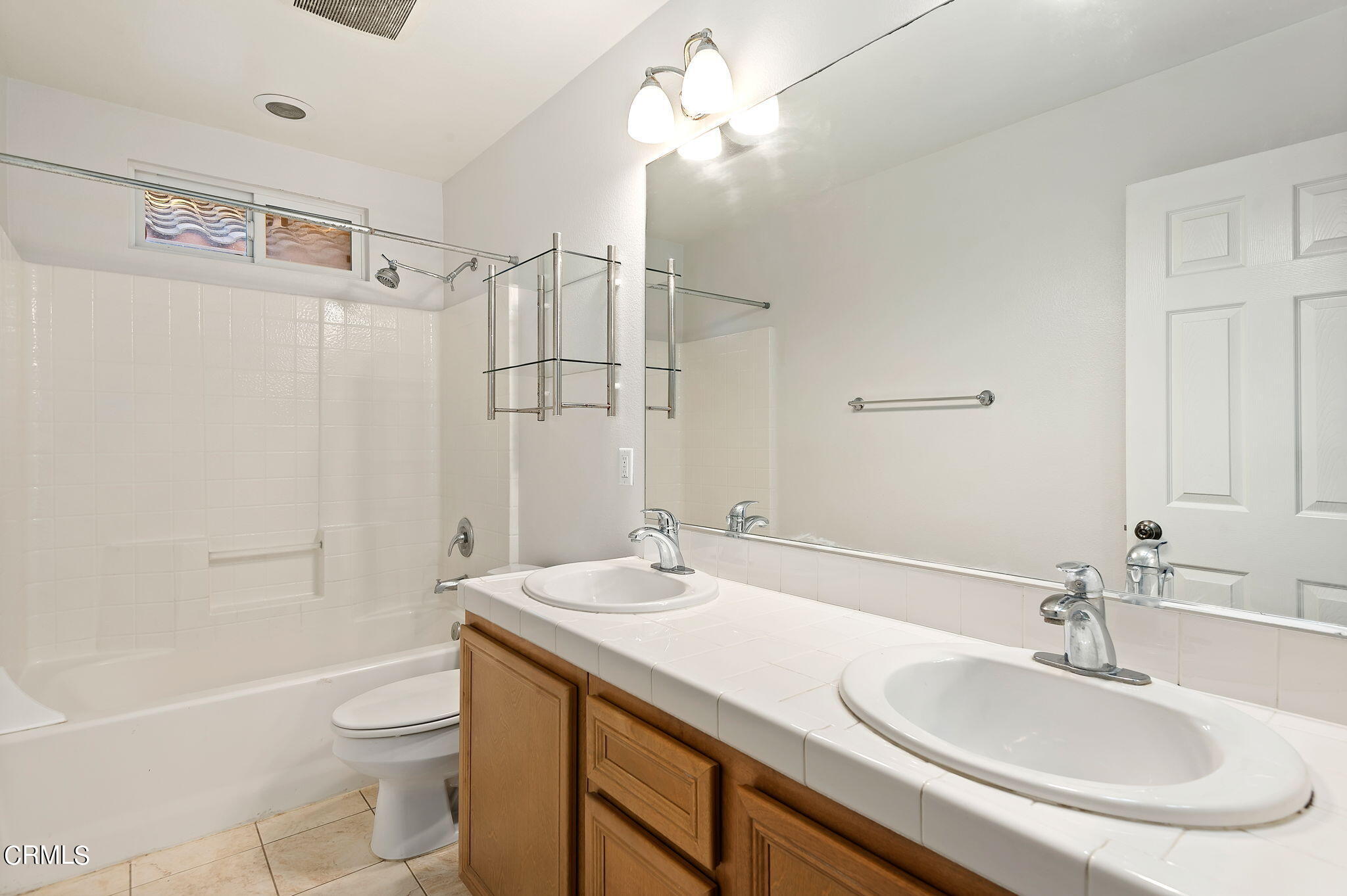 2824 Yacht Way Oxnard, CA 93035 - Photo 15 of 24 a bathroom with a sink a toilet a mirror and shower