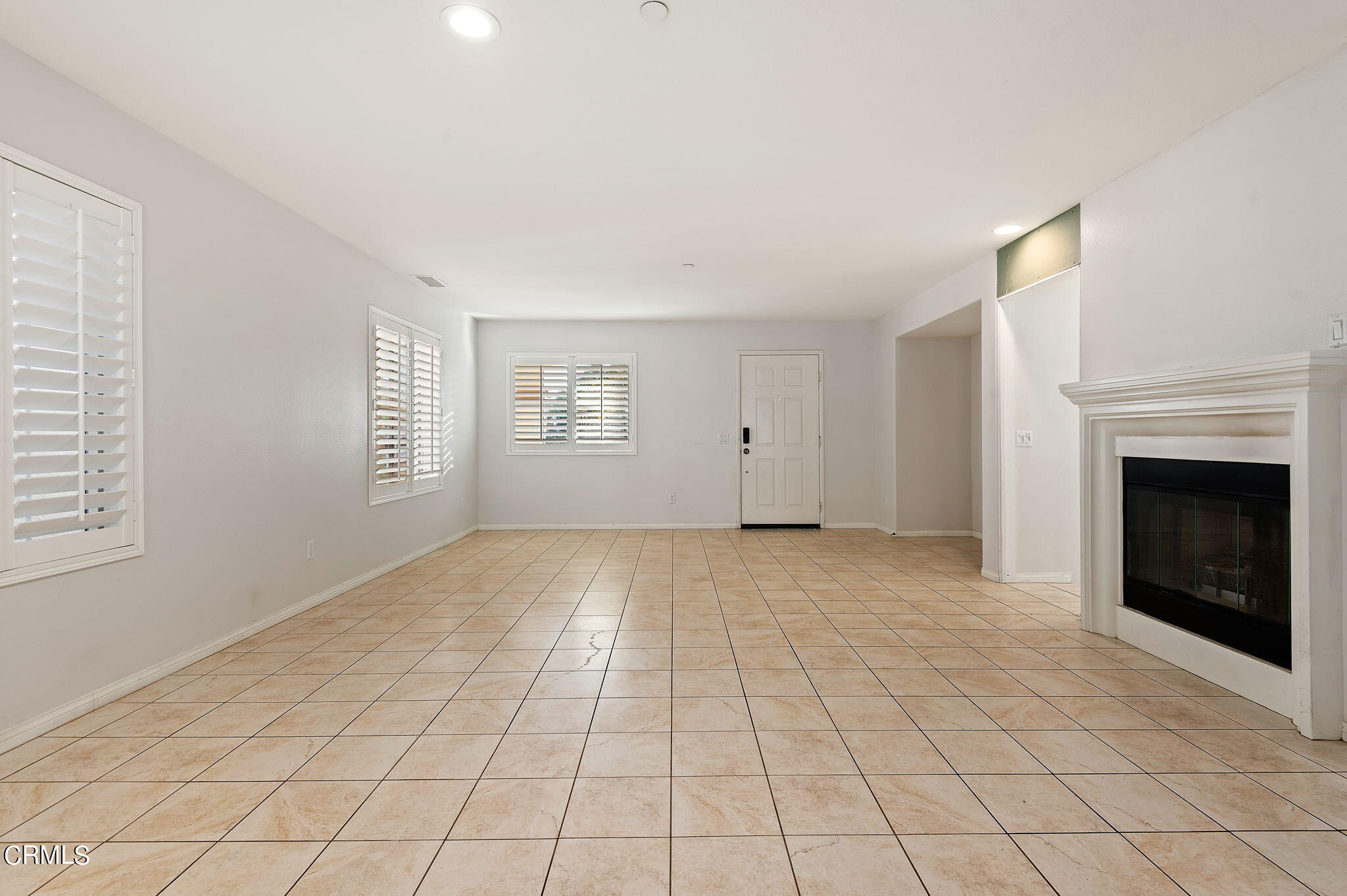 2824 Yacht Way Oxnard, CA 93035 - Photo 4 of 24 a view of an empty room with window and fireplace
