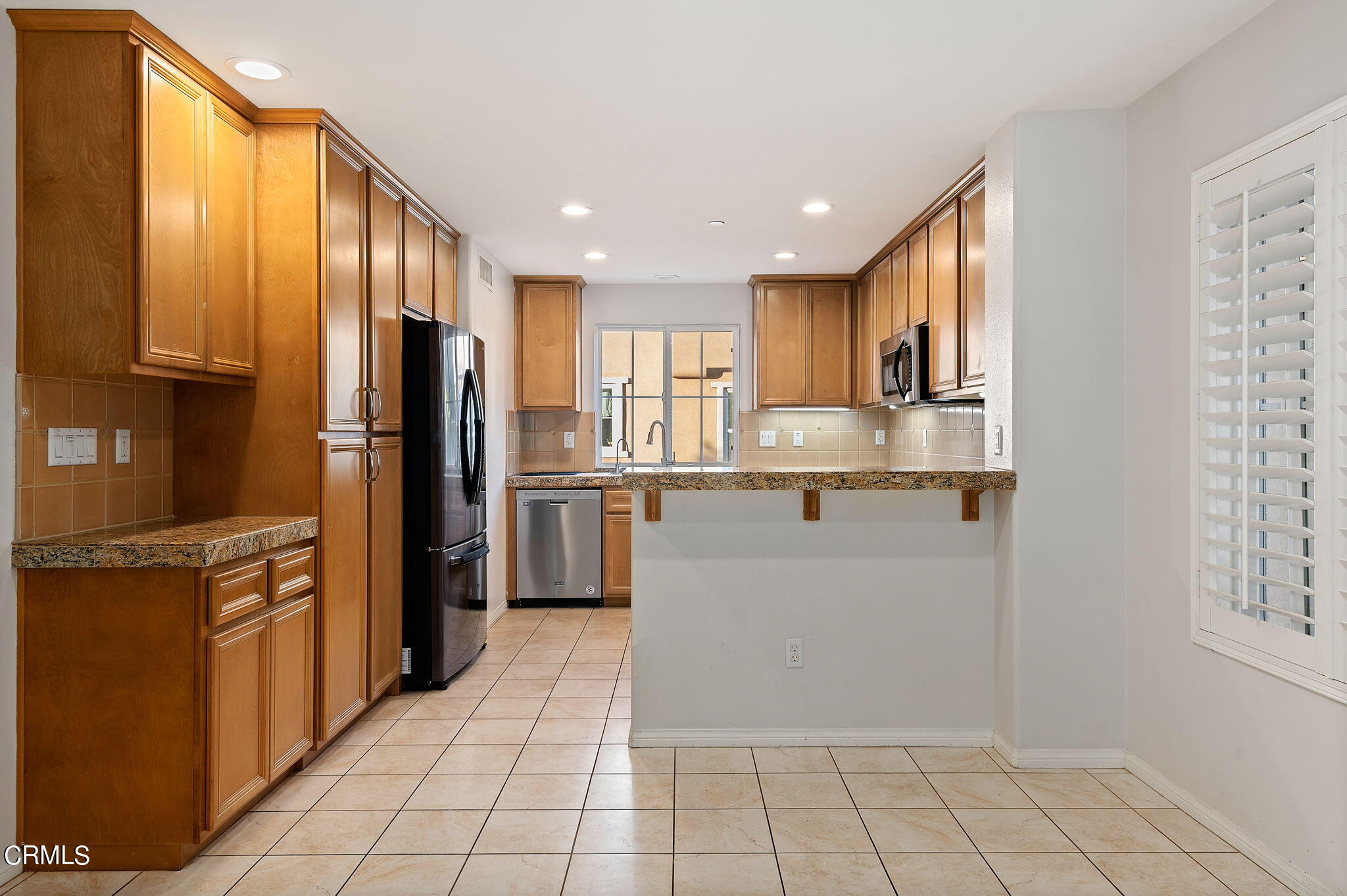 2824 Yacht Way Oxnard, CA 93035 - Photo 6 of 24 a kitchen with stainless steel appliances granite countertop a refrigerator and a sink
