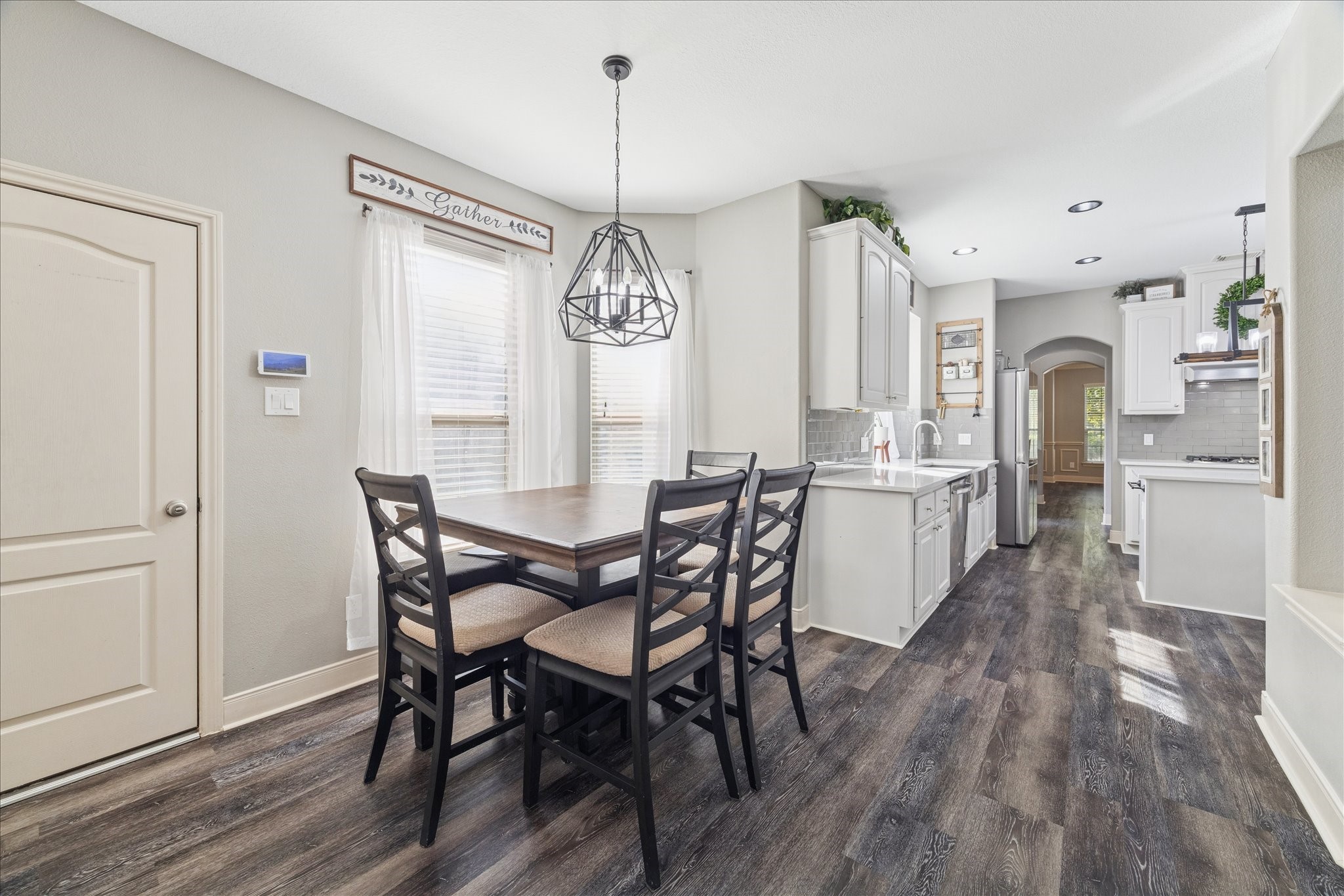 31030 North Imperial Path Lane Spring, TX 77386 - Photo 10 of 38 a view of a dining room with furniture window and wooden floor