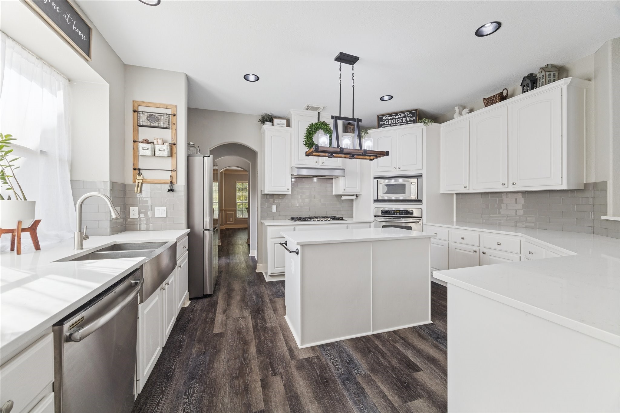 31030 North Imperial Path Lane Spring, TX 77386 - Photo 11 of 38 a kitchen with a sink stove and cabinets