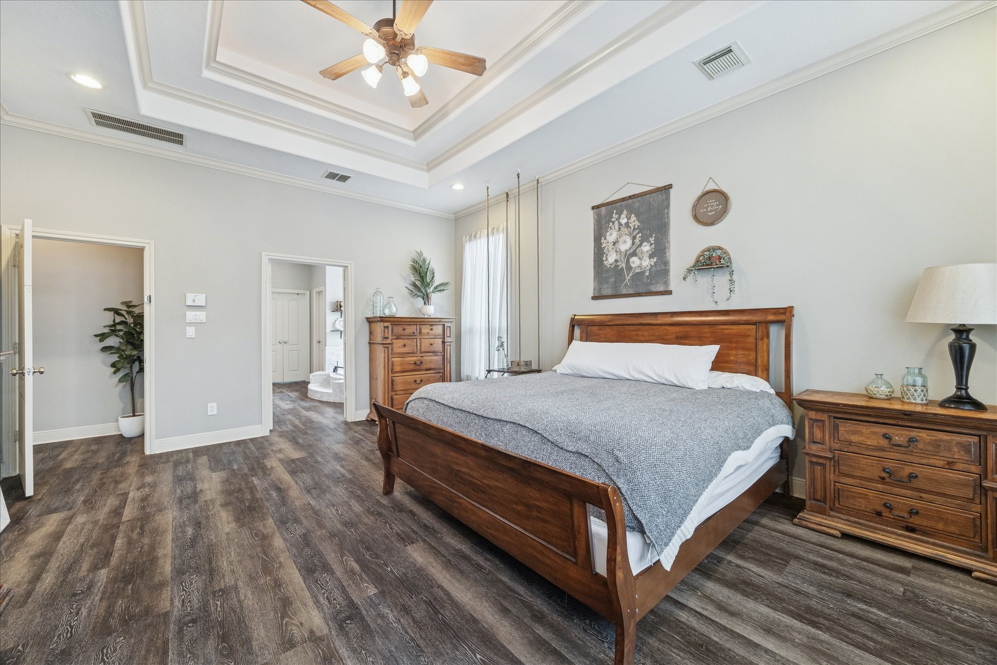 31030 North Imperial Path Lane Spring, TX 77386 - Photo 17 of 38 a bedroom with a large bed and a chandelier