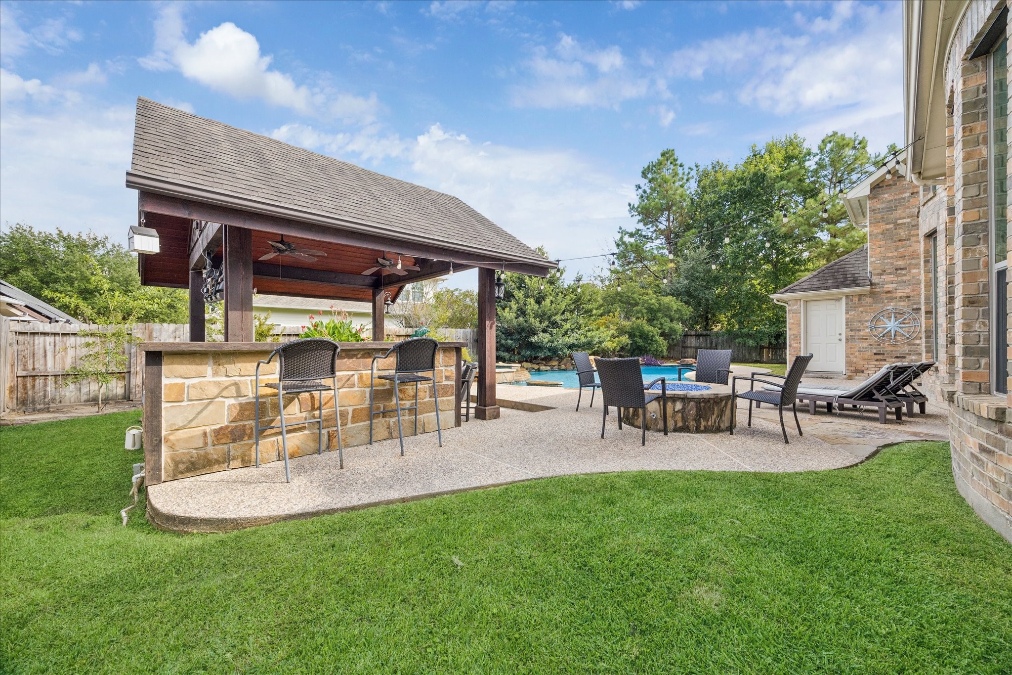 31030 North Imperial Path Lane Spring, TX 77386 - Photo 35 of 38 a view of a chairs and table in patio with a yard