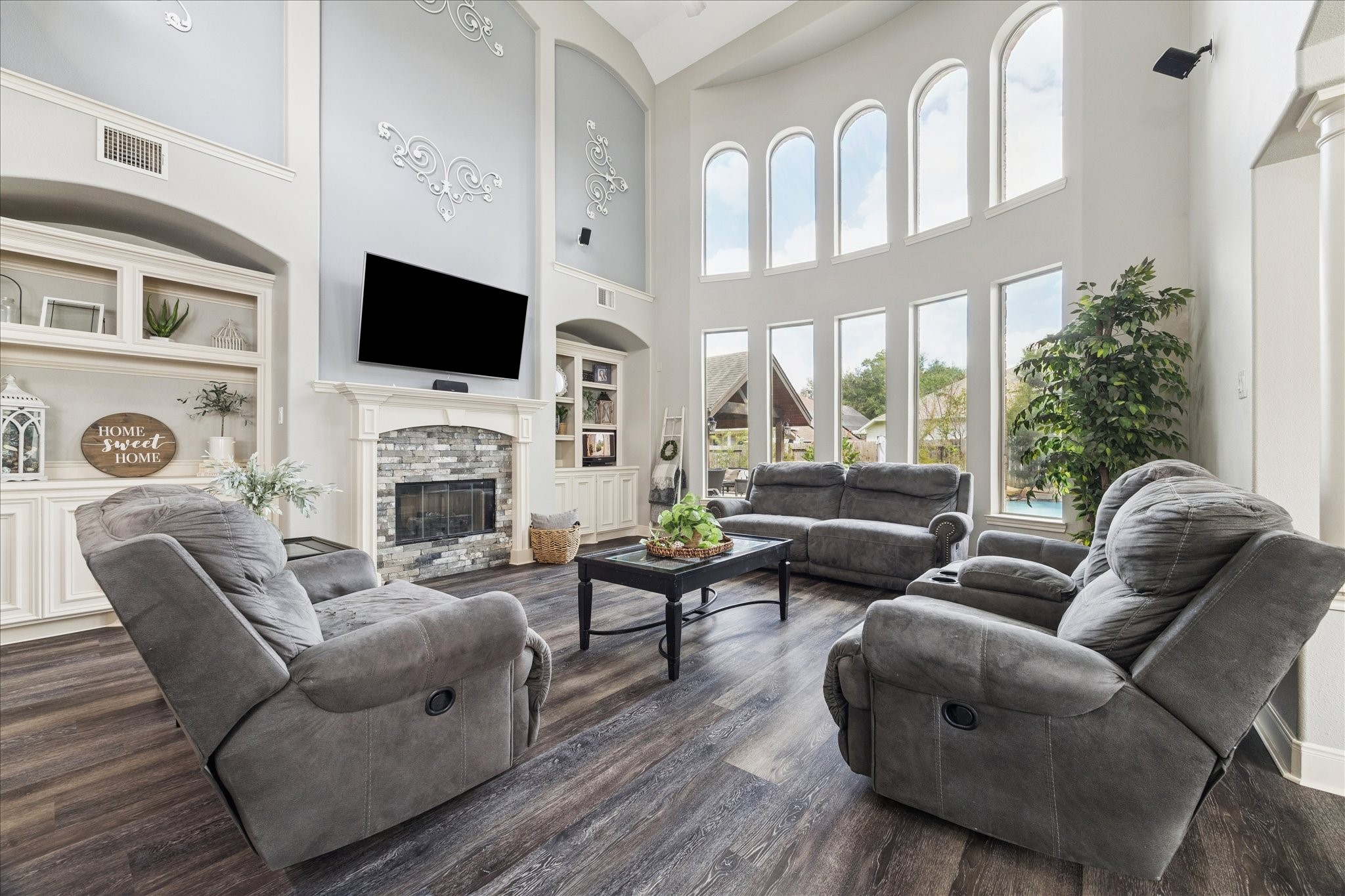 31030 North Imperial Path Lane Spring, TX 77386 - Photo 9 of 38 a living room with furniture a fireplace and a flat screen tv