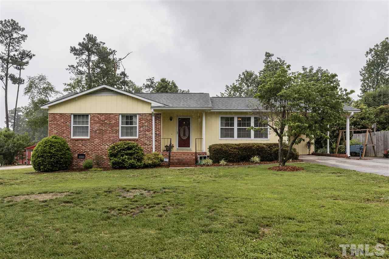 3929 Haithcock Road Raleigh, NC 27604 - Photo 1 of 11 a view of a house with a yard