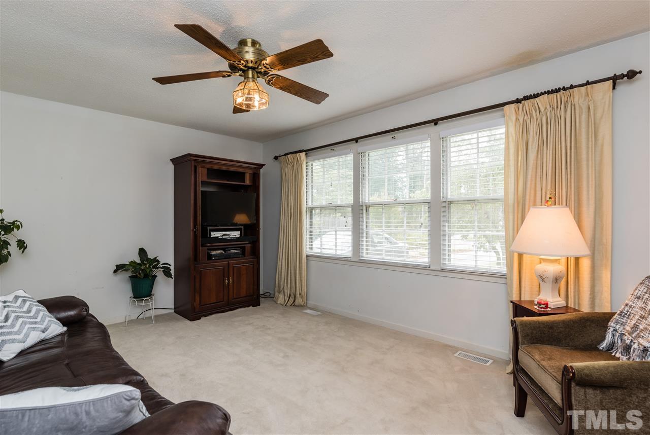 3929 Haithcock Road Raleigh, NC 27604 - Photo 2 of 11 a living room with furniture and a window