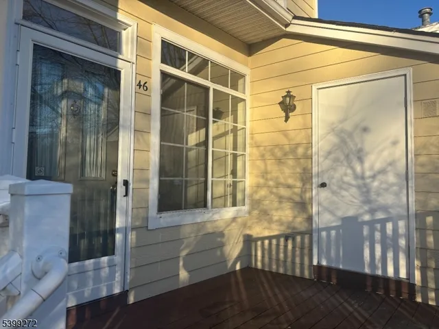 a bathroom with a glass door shower