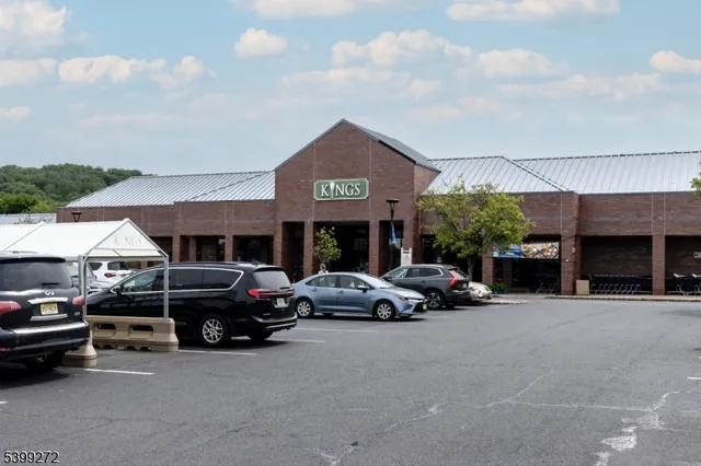 a view of a car park in front of house