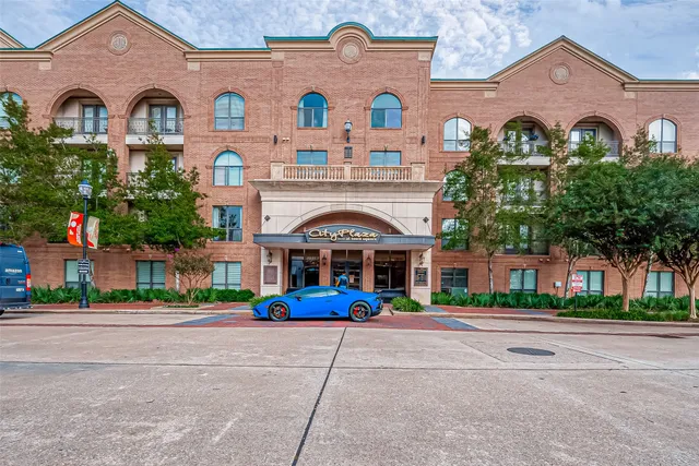 a view of multiple houses with a city street