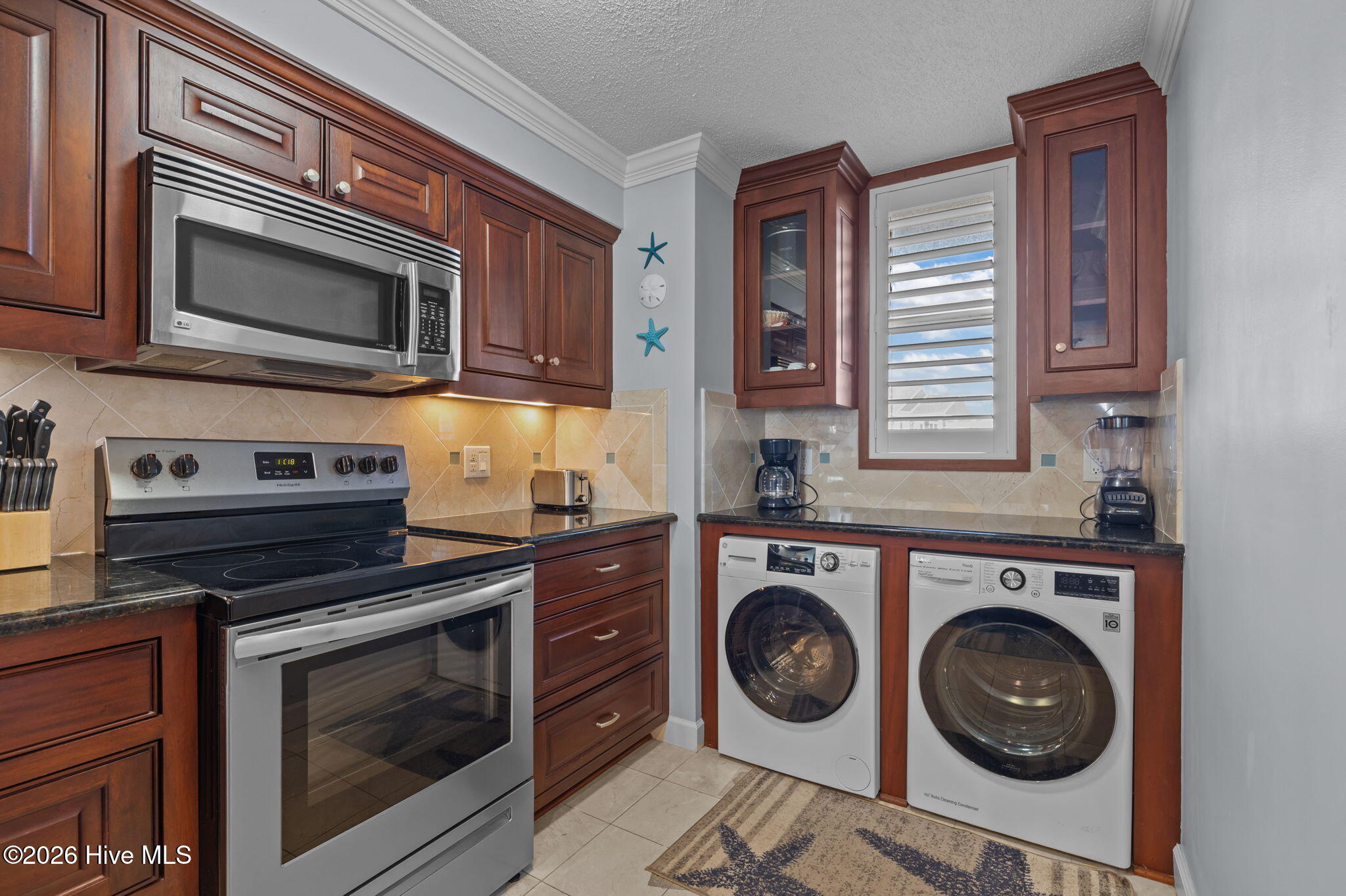 1505 Salter Path Road, Unit 228 Indian Beach, NC 28512 - Photo 6 of 41 Kitchen/Laundry Area