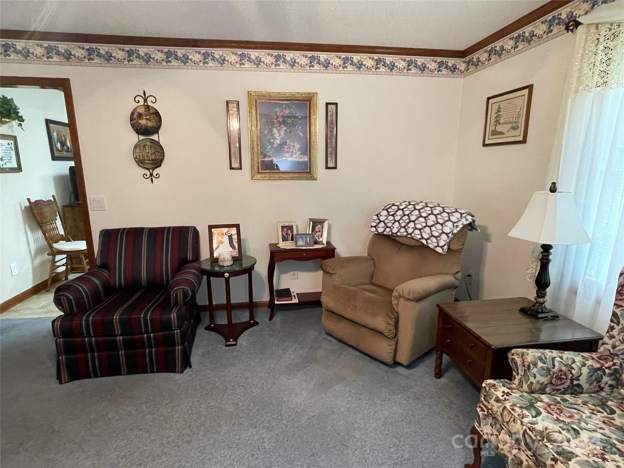 36345 Old Salisbury Road New London, NC 28127 - Photo 17 of 48 a living room with furniture and a window
