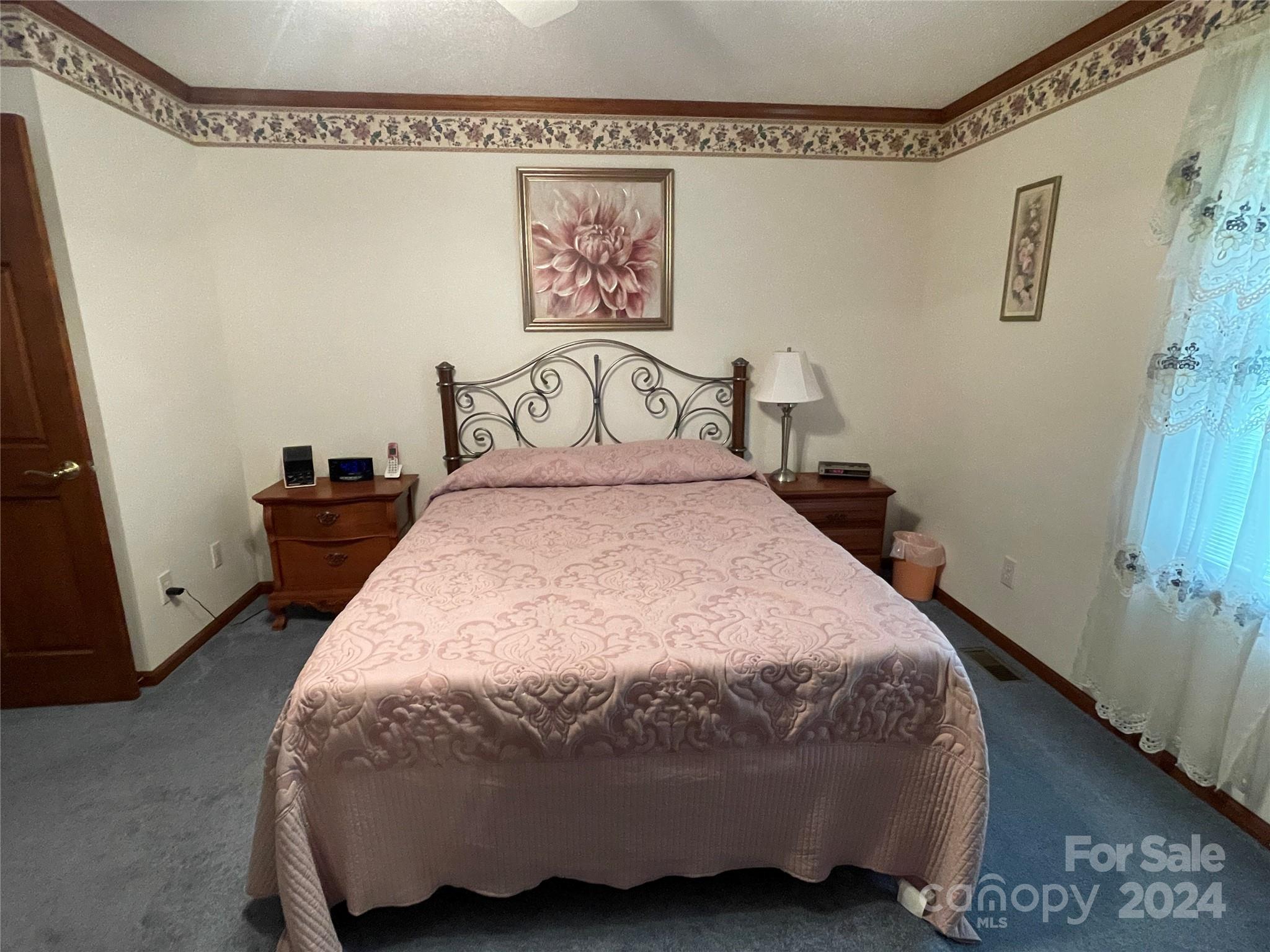 36345 Old Salisbury Road New London, NC 28127 - Photo 19 of 48 a bedroom with a bed and painting on the wall