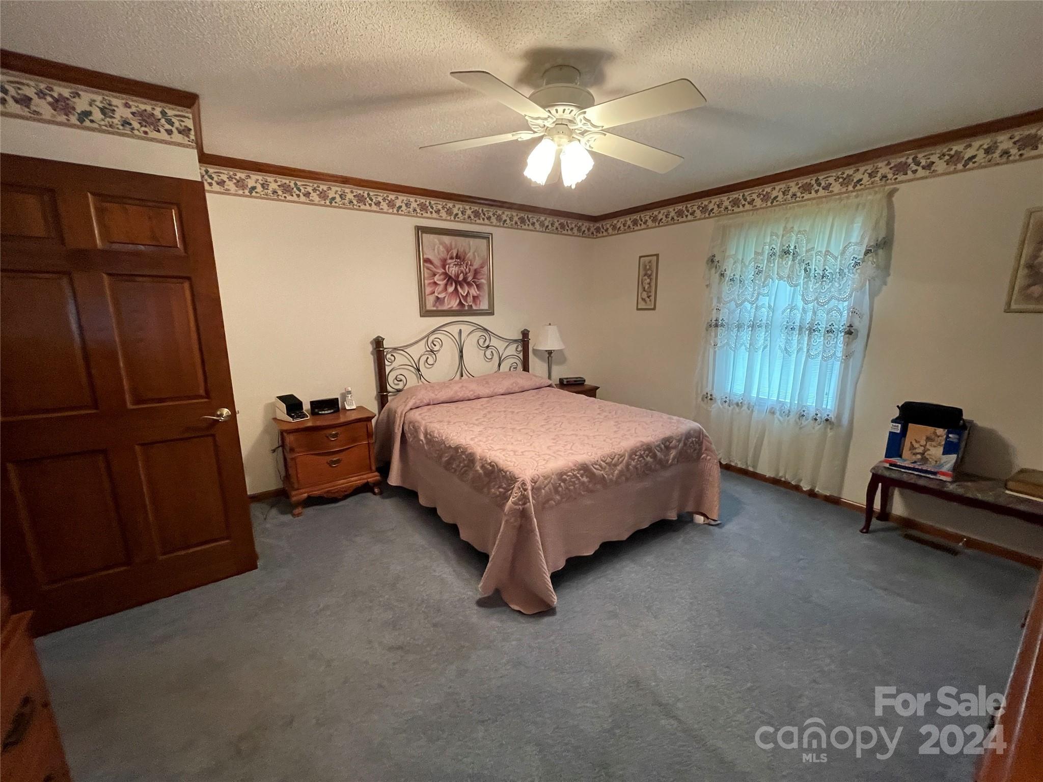36345 Old Salisbury Road New London, NC 28127 - Photo 21 of 48 a bed sitting in a room next to a window