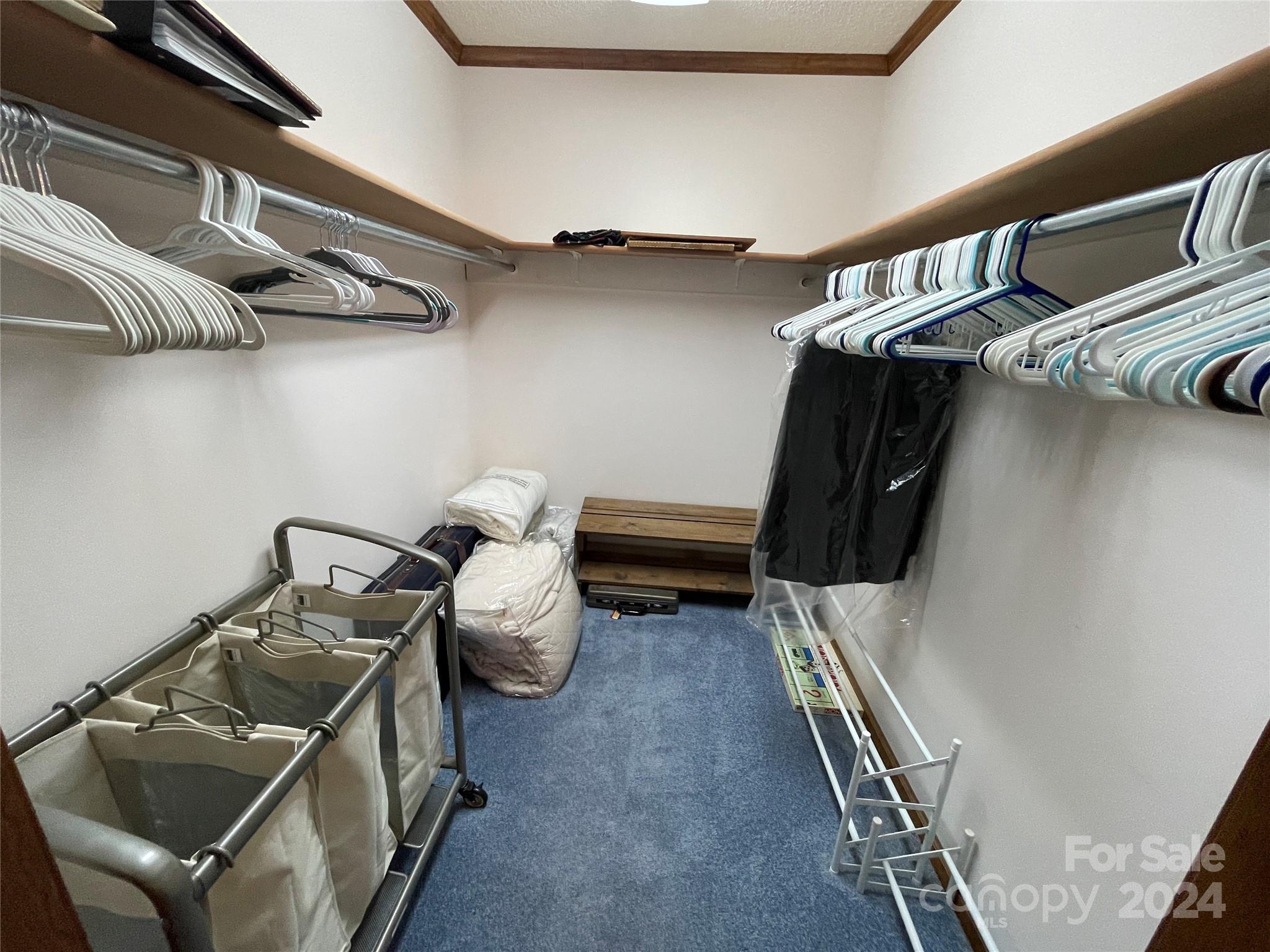 36345 Old Salisbury Road New London, NC 28127 - Photo 22 of 48 a view of walk in closet with clothes and shoes