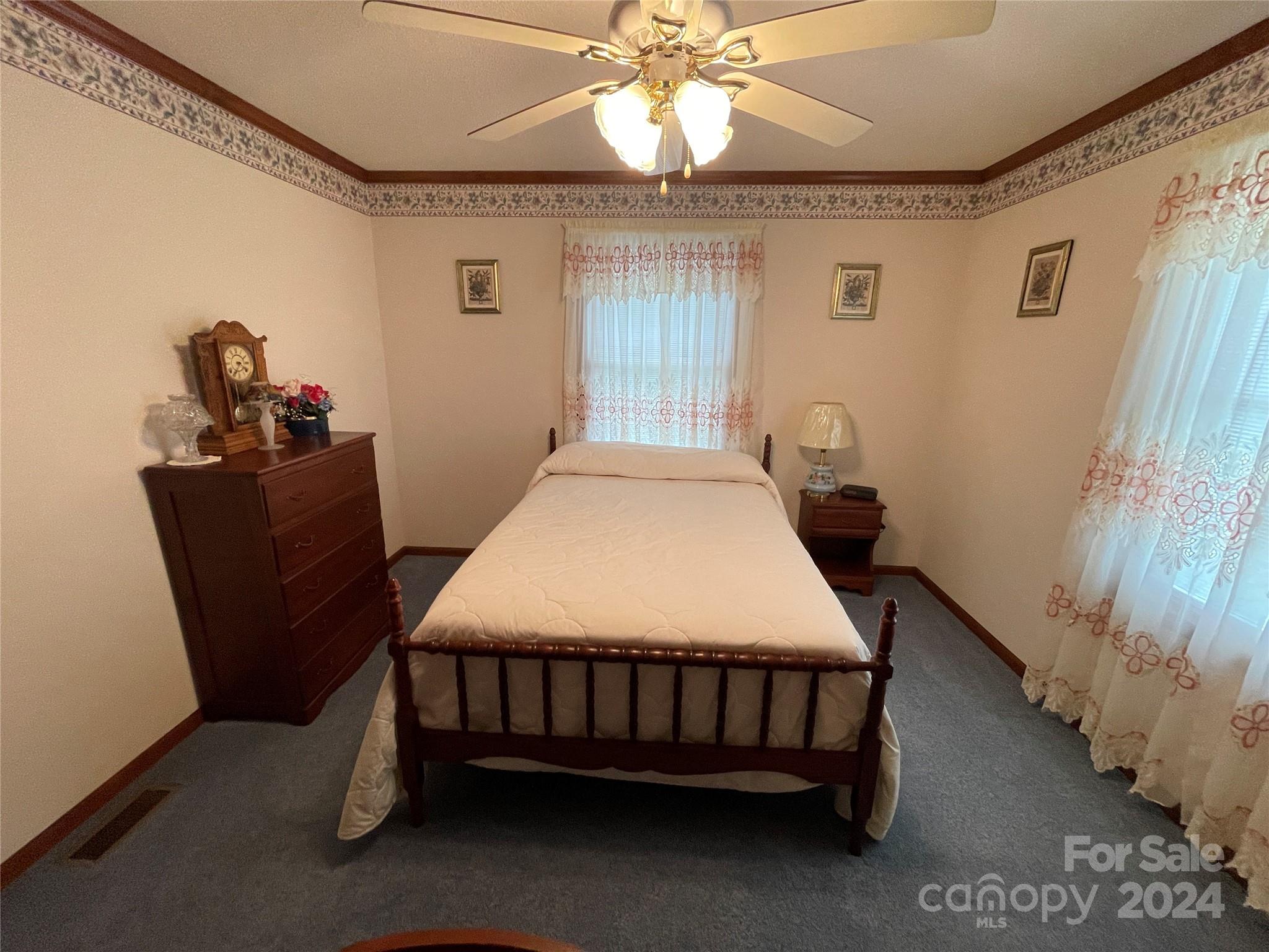 36345 Old Salisbury Road New London, NC 28127 - Photo 30 of 48 a bed sitting in a bedroom next to a window