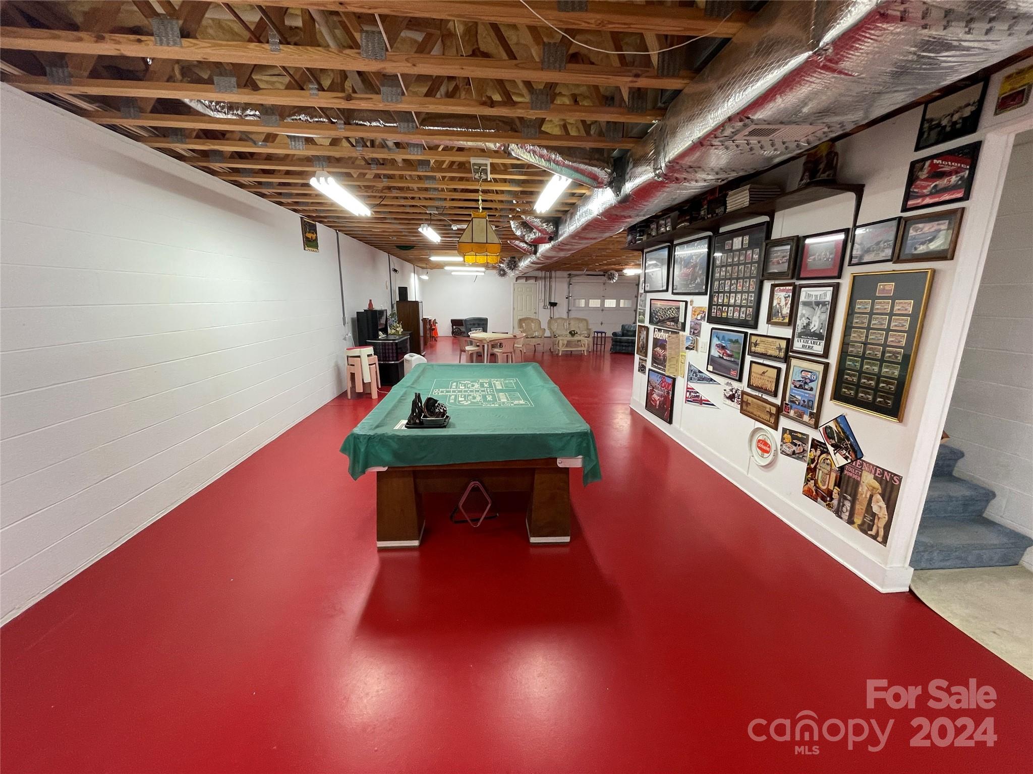 36345 Old Salisbury Road New London, NC 28127 - Photo 35 of 48 a room with lots of furniture and a wooden floor