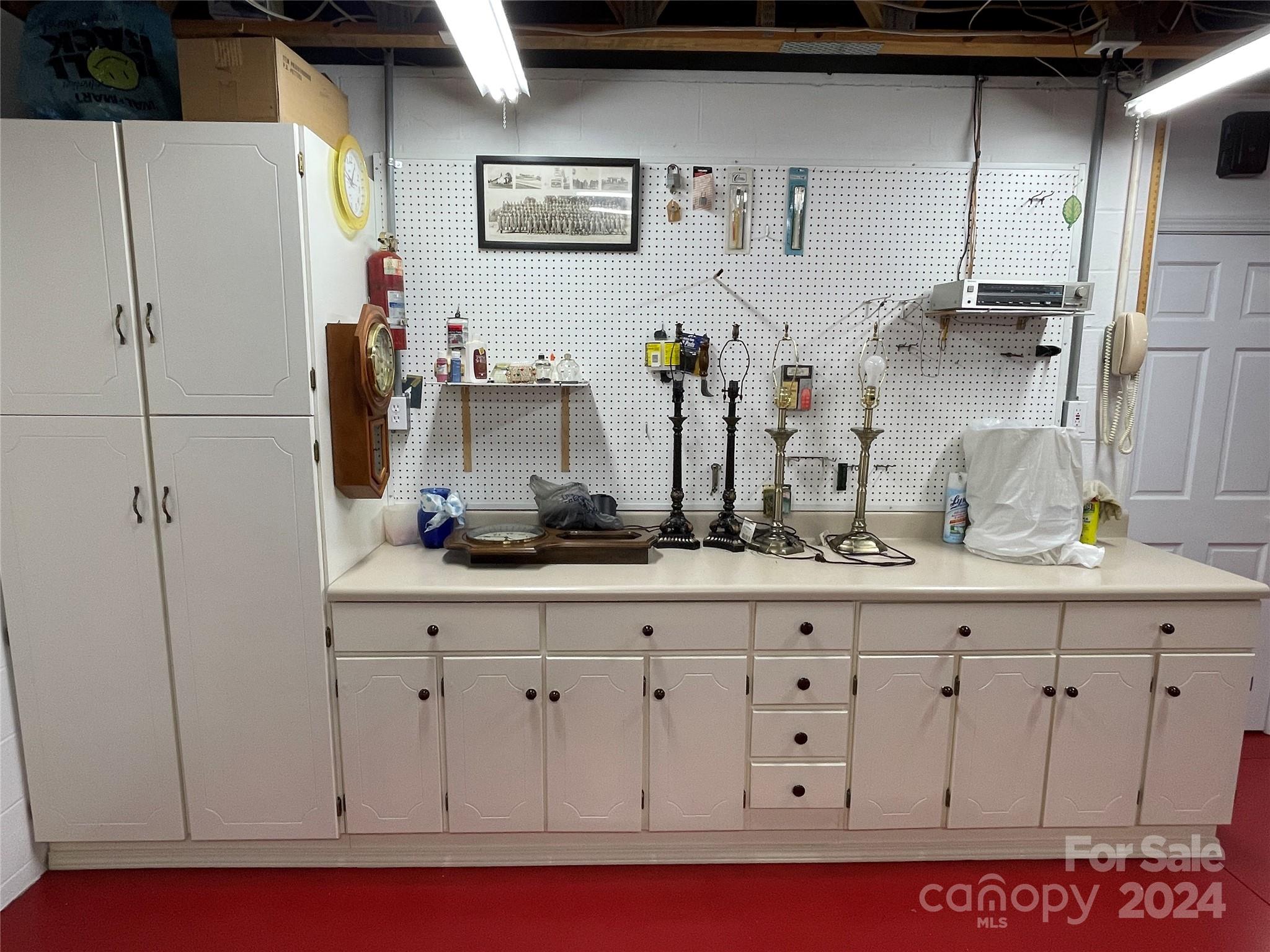 36345 Old Salisbury Road New London, NC 28127 - Photo 38 of 48 a kitchen with cabinets and white appliances