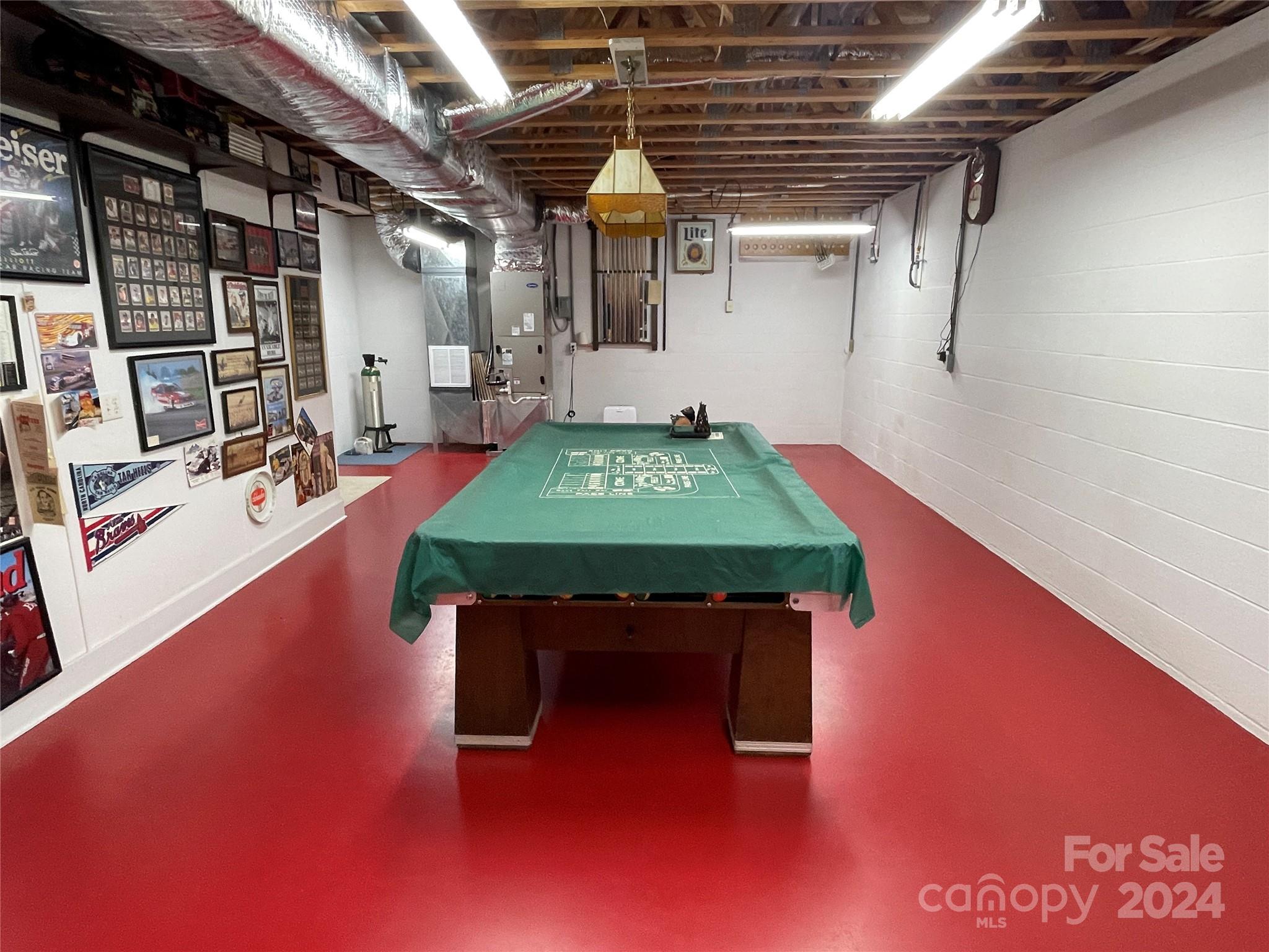 36345 Old Salisbury Road New London, NC 28127 - Photo 39 of 48 a room with pool table windows and wooden floor
