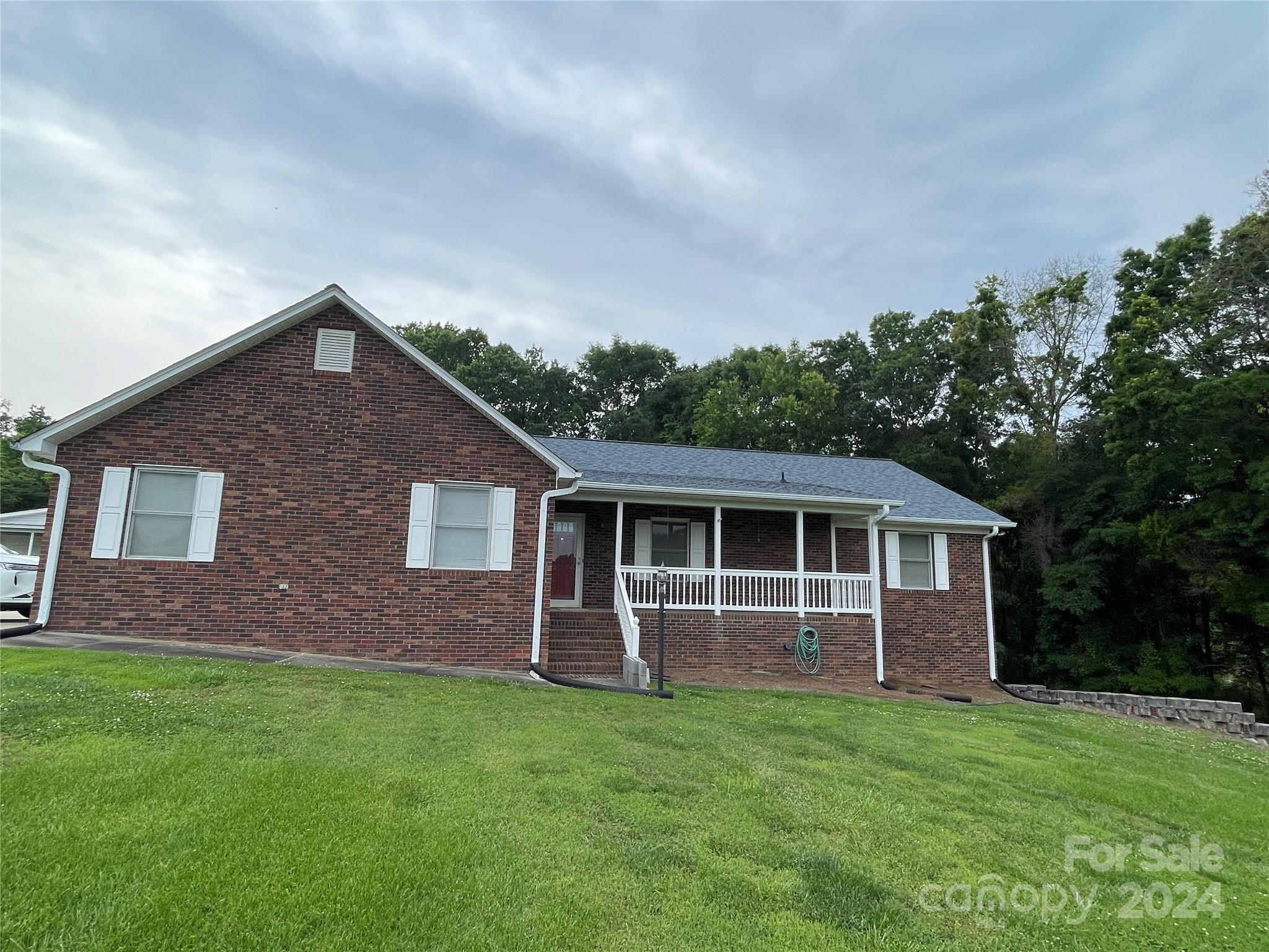 36345 Old Salisbury Road New London, NC 28127 - Photo 44 of 48 a front view of house with yard and green space
