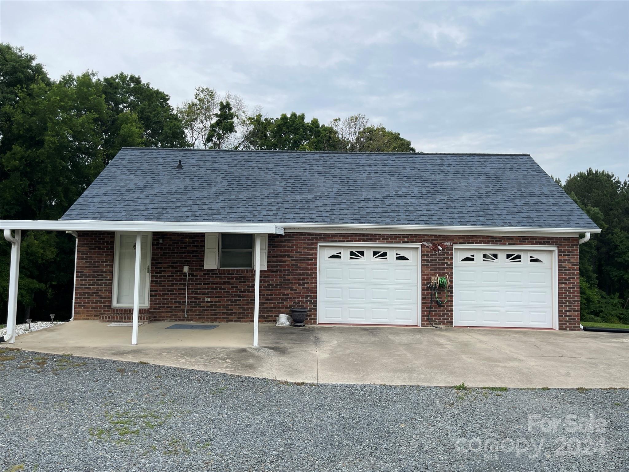 36345 Old Salisbury Road New London, NC 28127 - Photo 45 of 48 front view of a house with a yard and garage